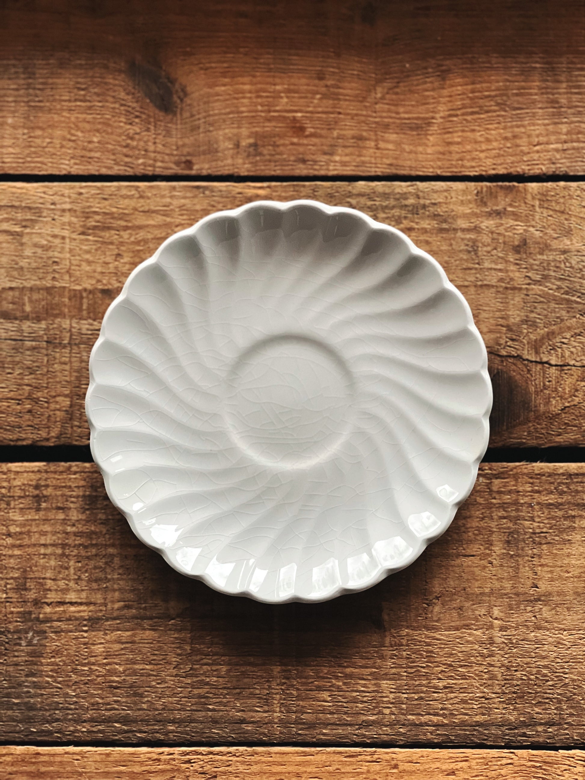 White ceramic dish on a wooden surface