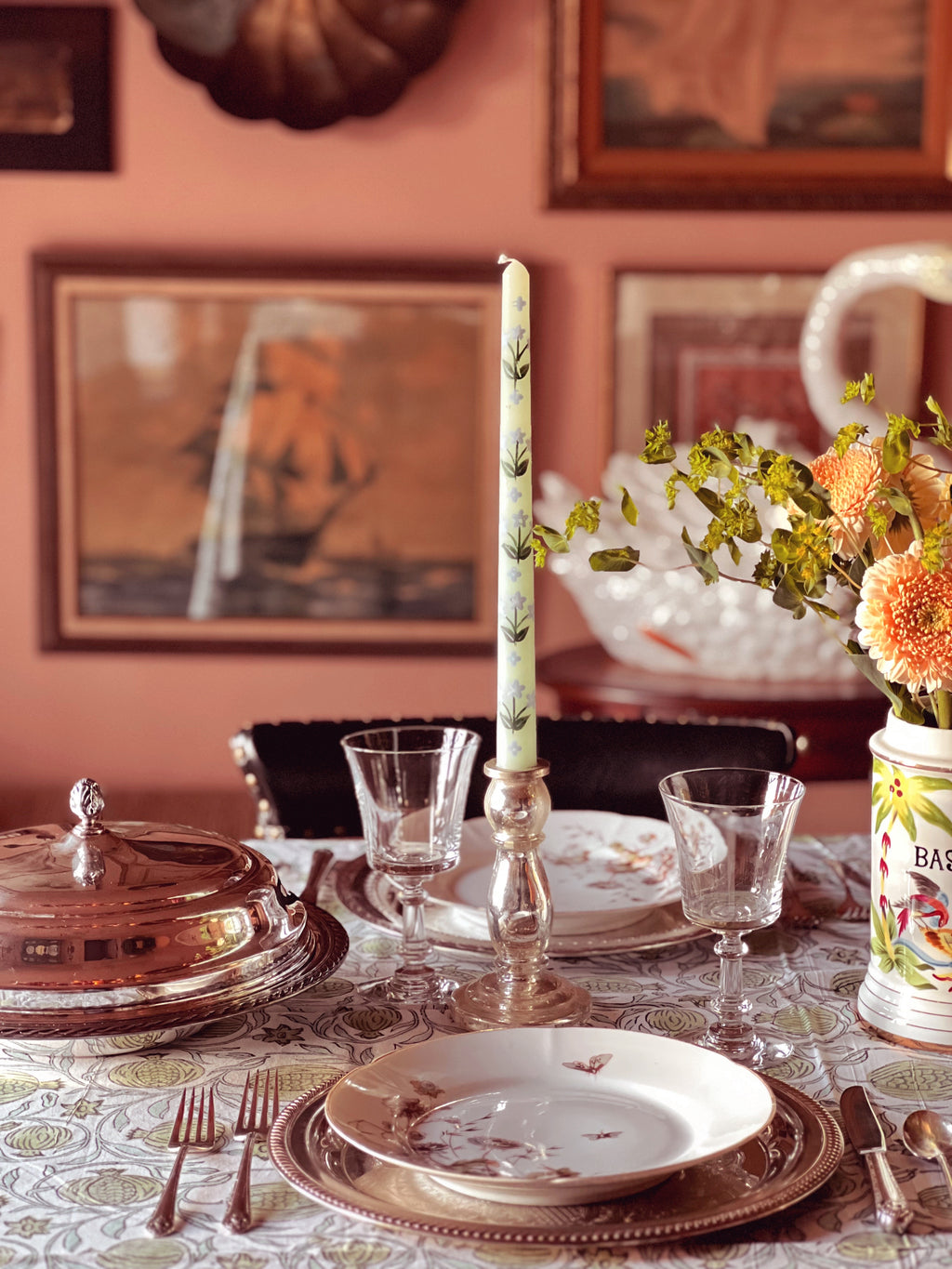 table set for a meal with silver serving pieces
