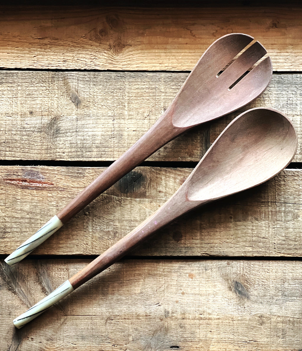 pair of wooden salad servers with a bone handle