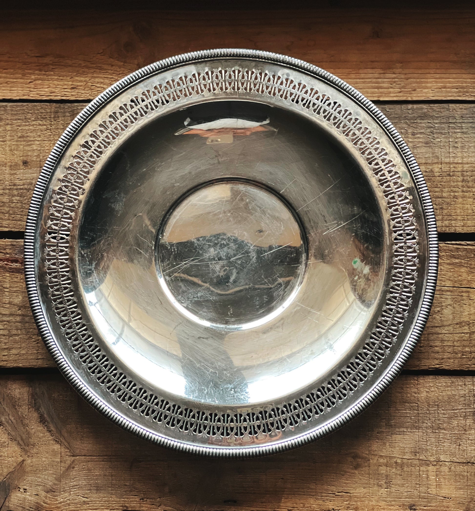 Silver decorative bowl on a wooden surface