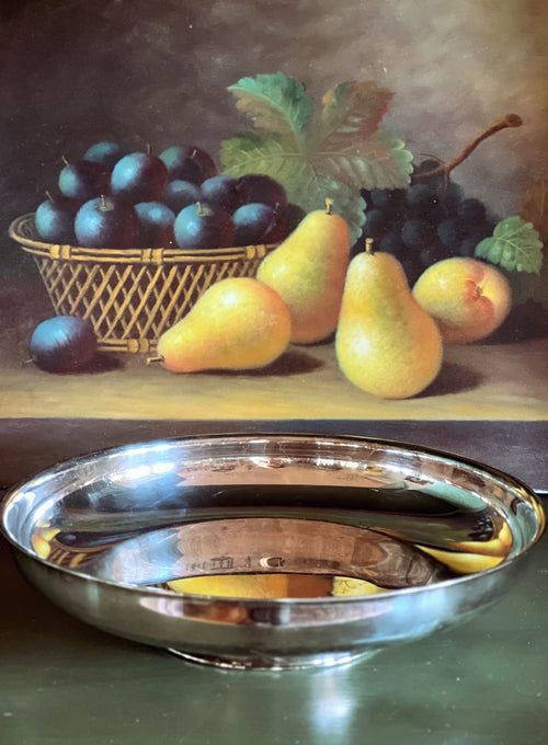 Still life painting of fruits including pears and plums with a silver bowl.