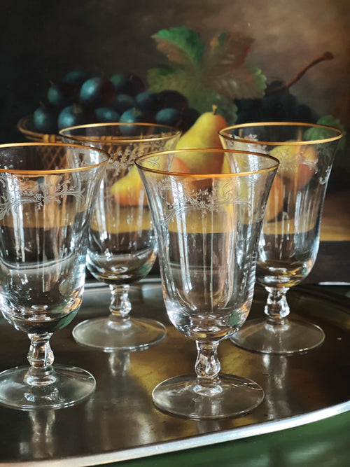 gold rim wine glass on a tray