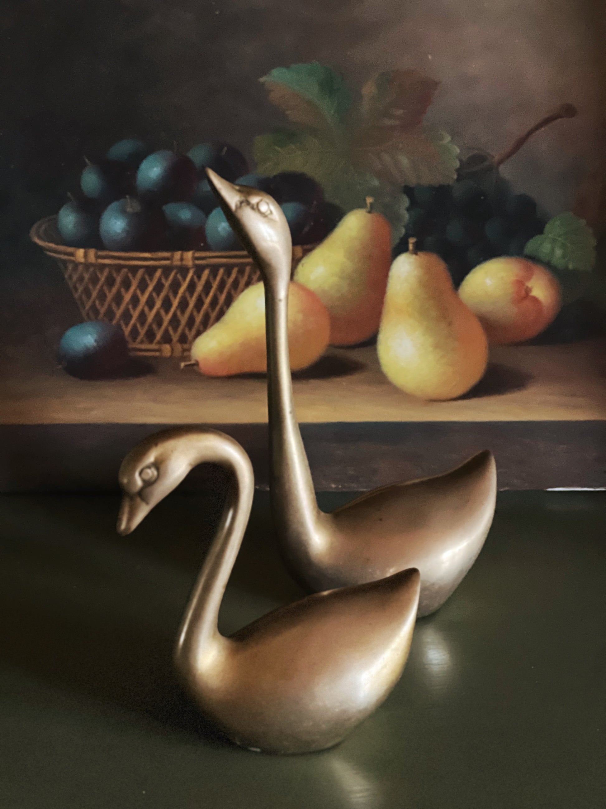 Elegant brass swan decor styled for vanity and shelf display
