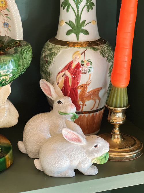 Decorative items including rabbit figurines and a painted vase on a shelf.