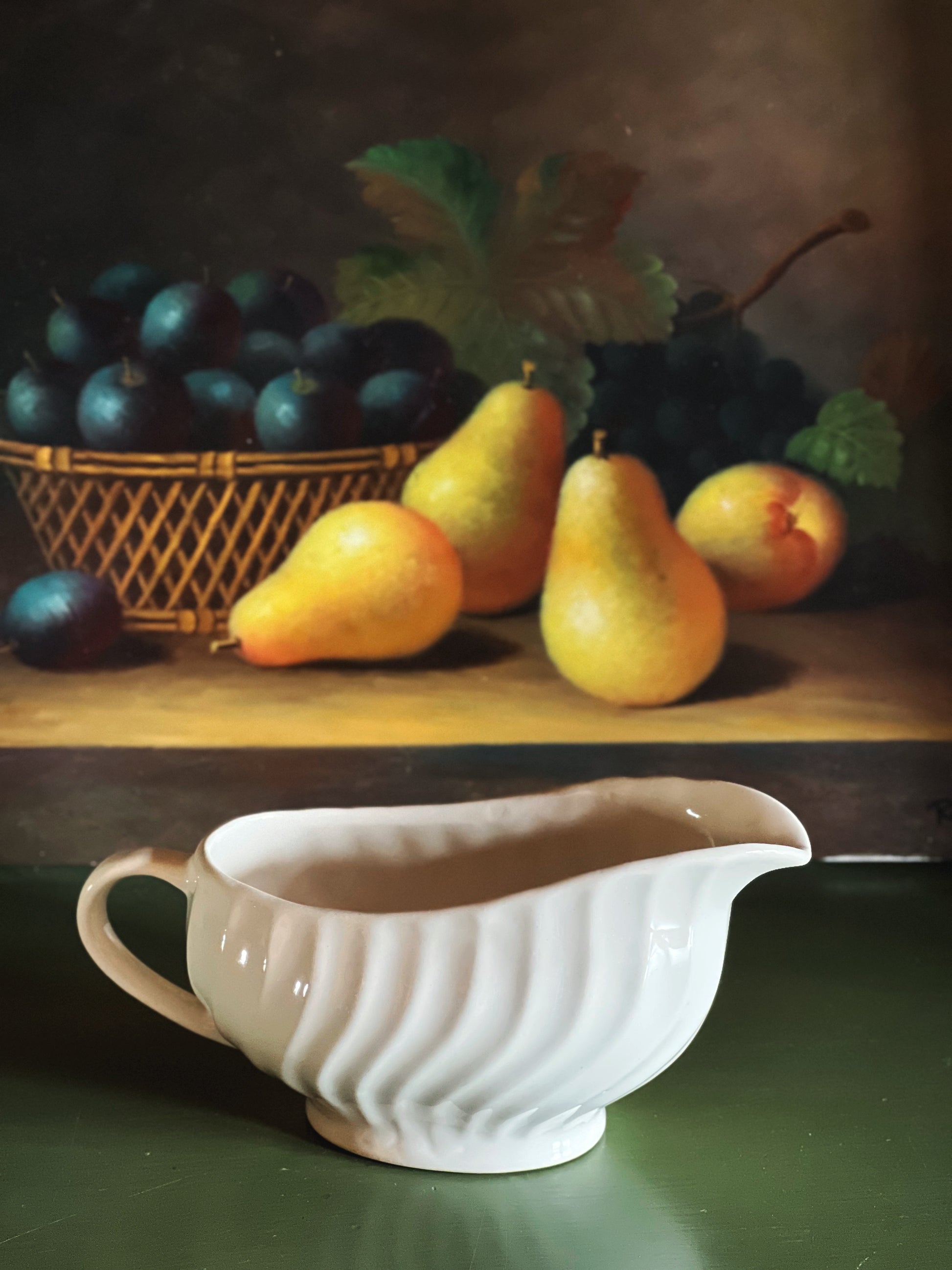 Vintage Johnson Brothers Regency gravy boat styled on a warm wood table with pears and moody still life styling