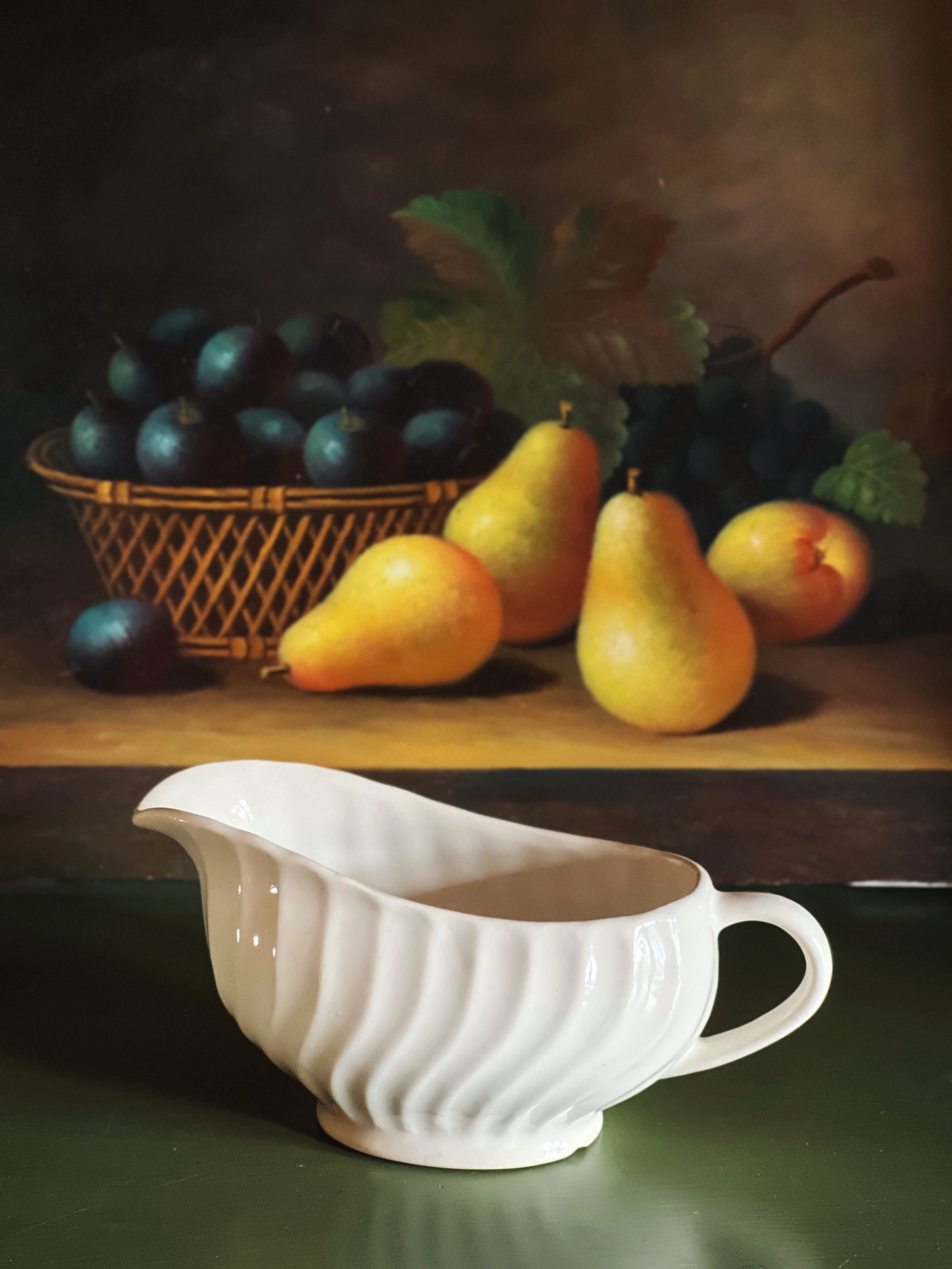Side profile of vintage Johnson Brothers Regency ironstone gravy boat with embossed swirl detail