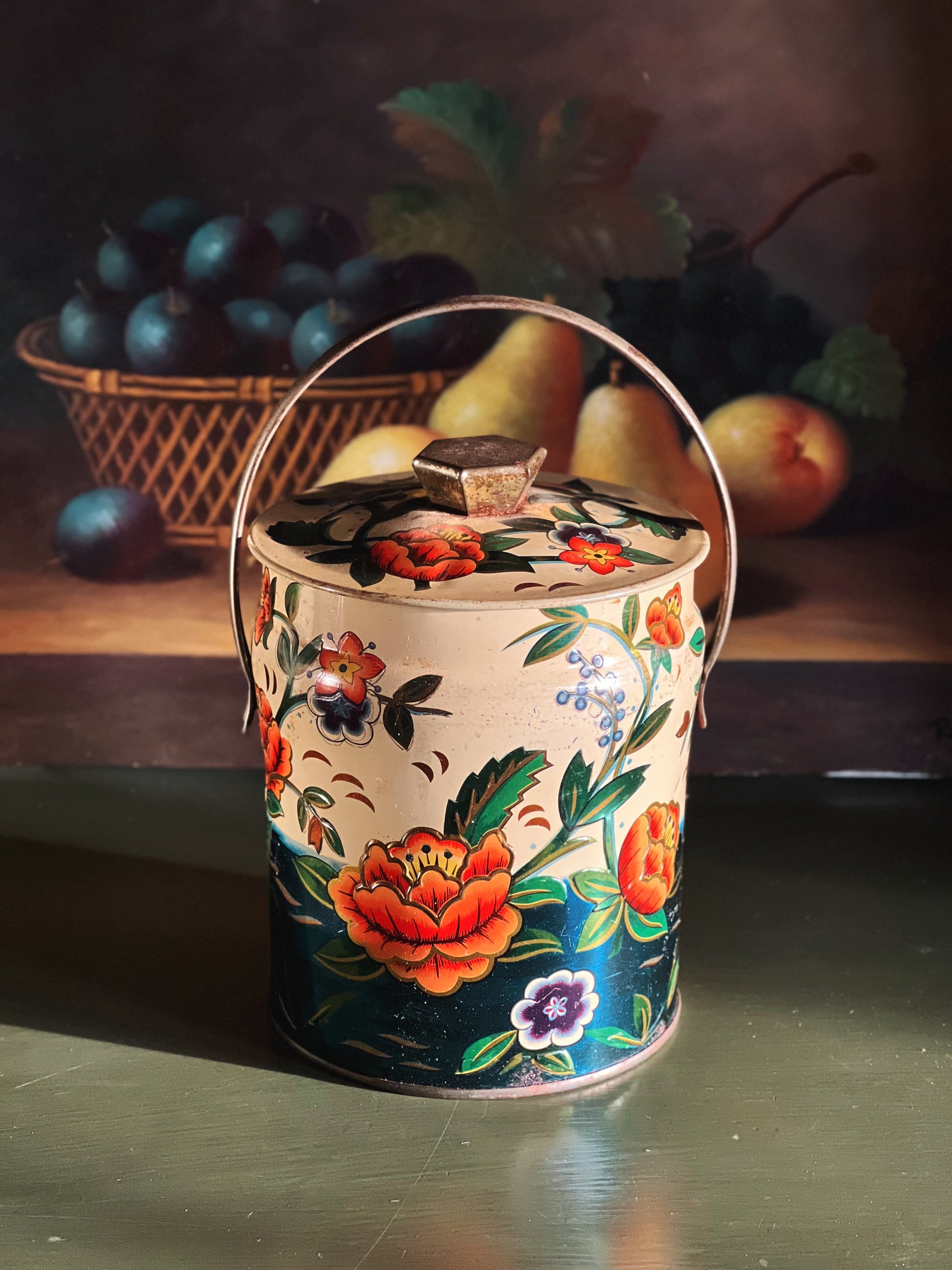 Decorative ceramic jar with floral design on a still life background