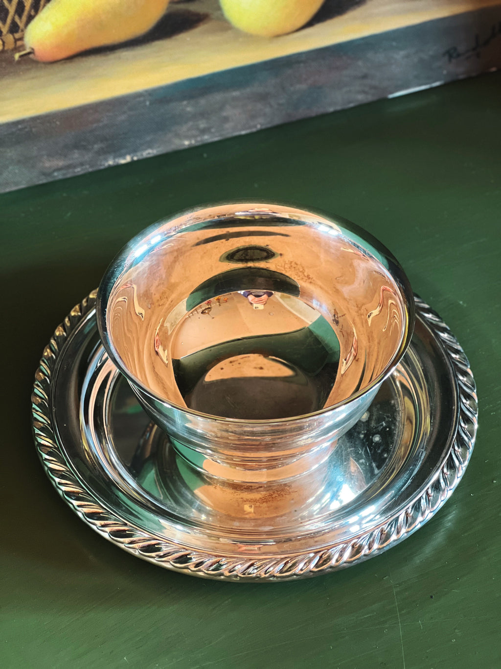 Top view of silver serving bowl showing interior and attached base