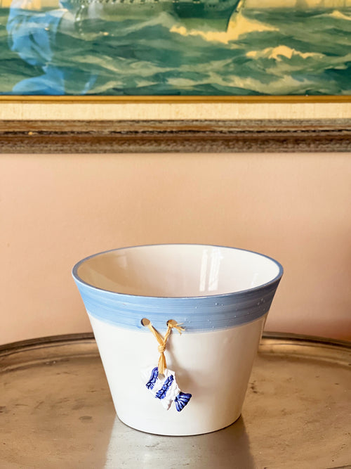 Vintage blue and white cachepot with hanging fish detail on front