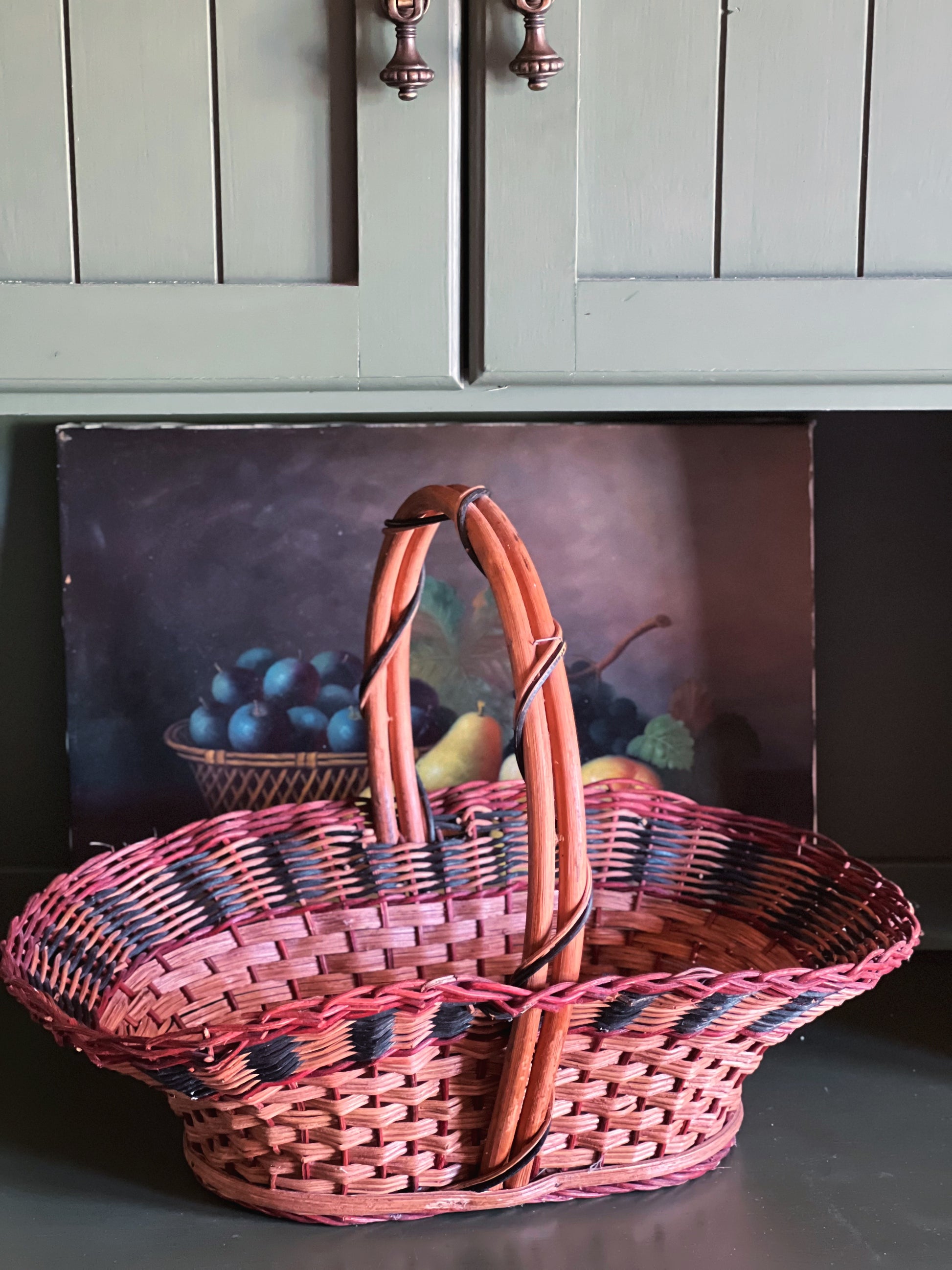 Vintage oval basket with multicolor weave and bamboo handle, gathering basket