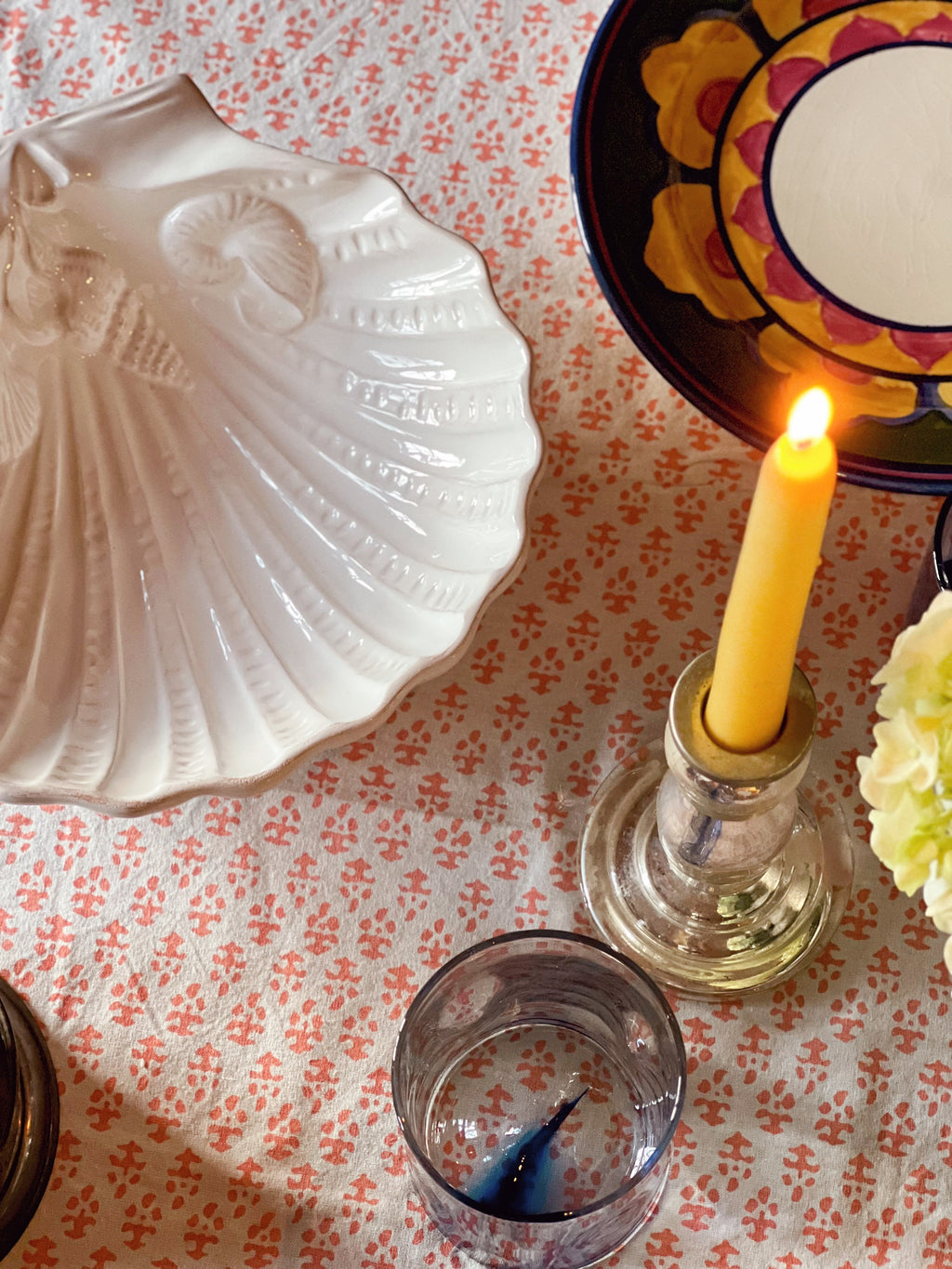 Close-up of embossed ceramic shell design on white serving dish