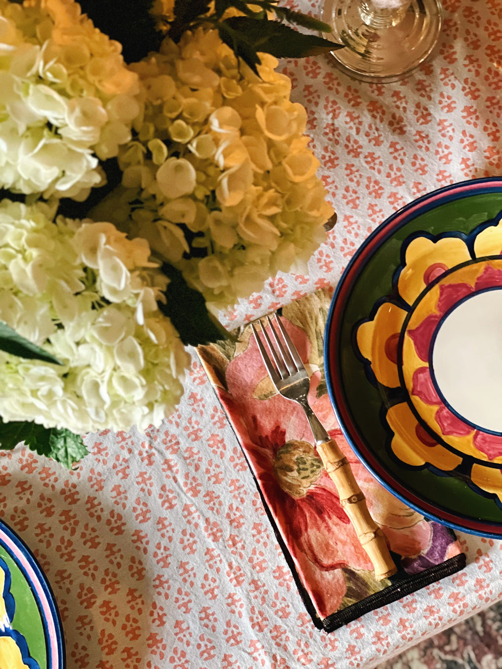 Close-up of apricot and white batik pattern on cotton tablecloth