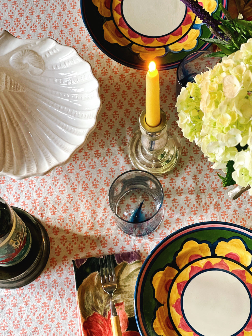 Silvered glass candle holders with brass inserts holding taper candles