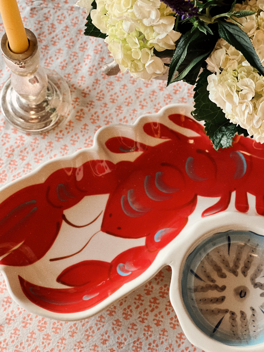 Close-up of red lobster design on ceramic serving platter