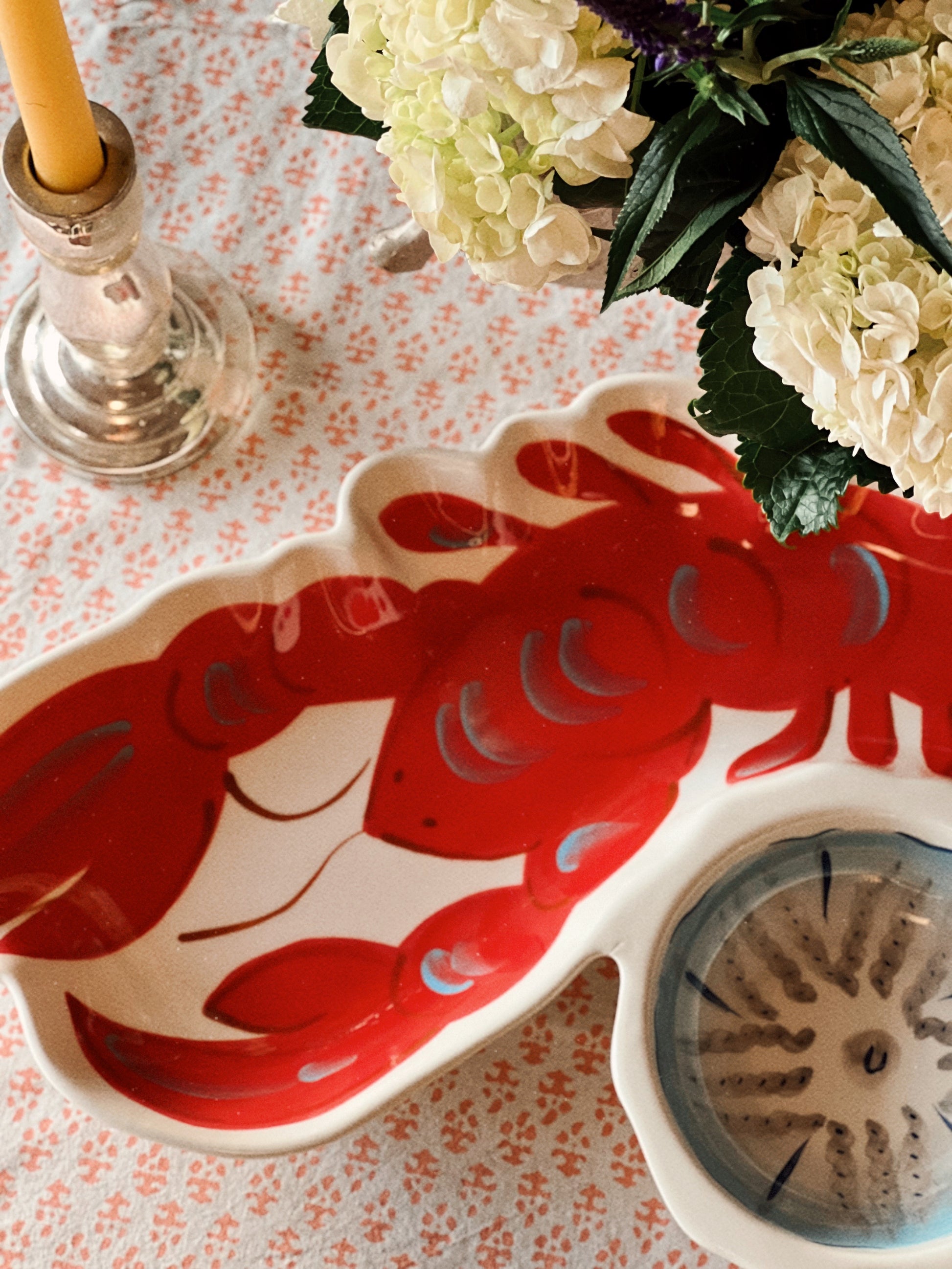Close-up of red lobster design on ceramic serving platter