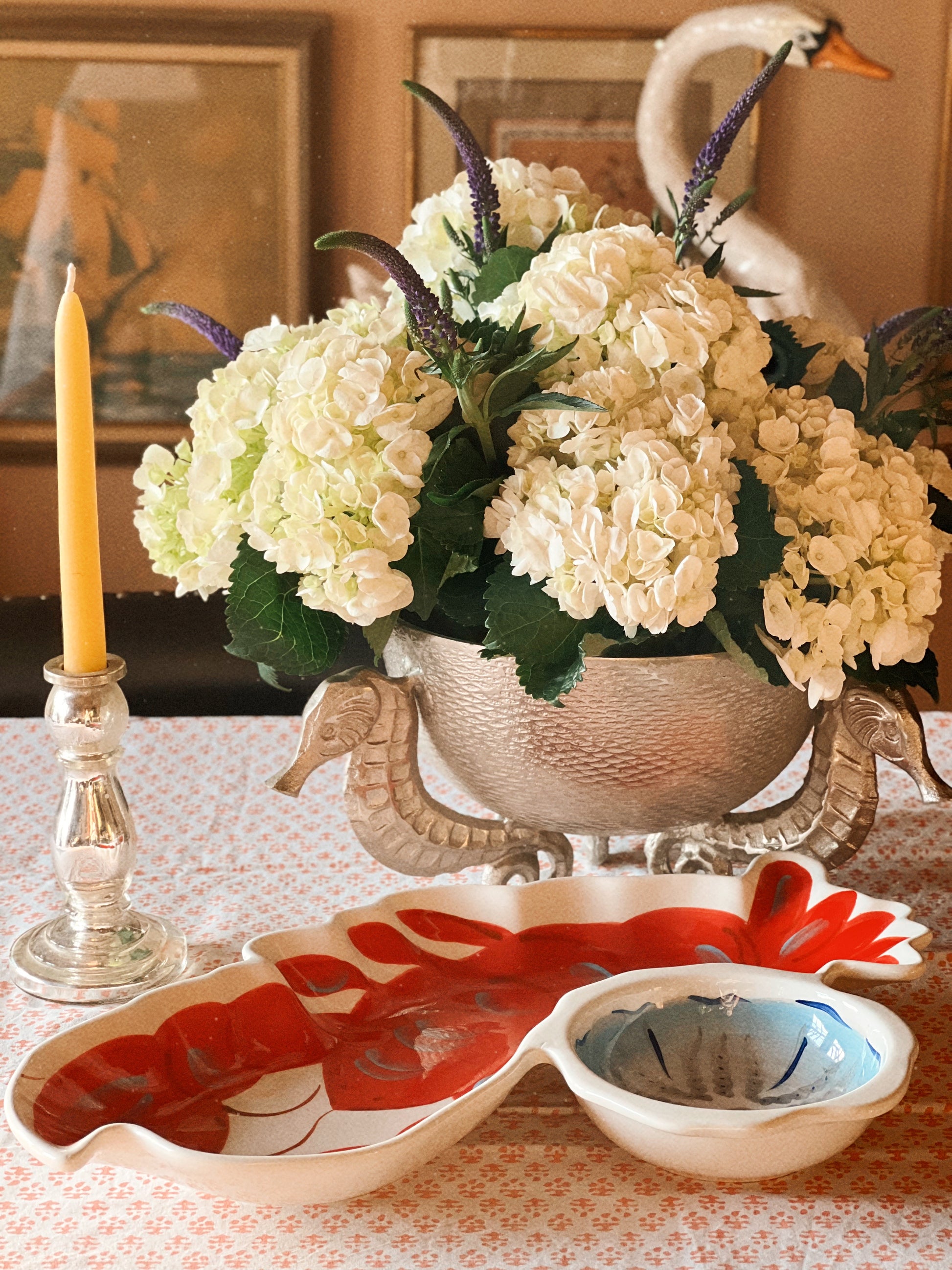 Coastal table with lobster serving platter used for entertaining