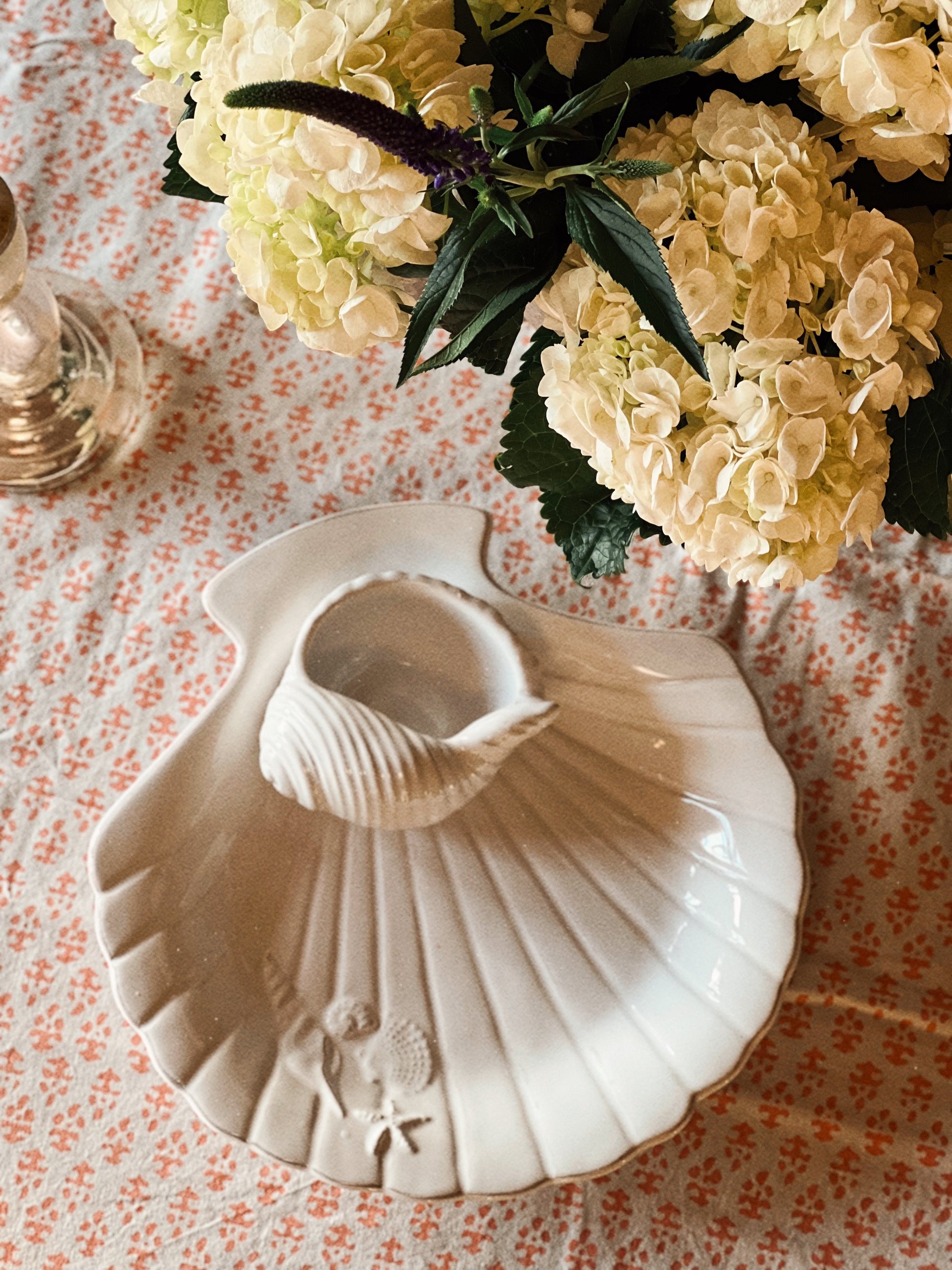 Overhead view of scallop shell chip and dip server with integrated bowl