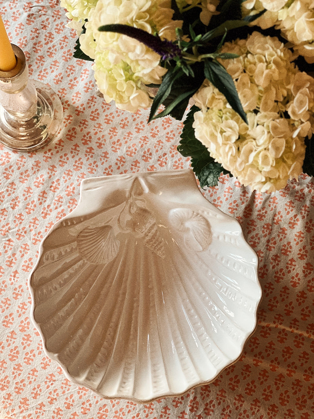 Overhead view of ceramic scallop shell dish with embossed texture