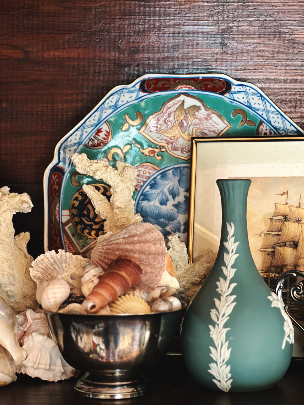 Small blue jasper ware vase layered into shelf styling, vintage decor