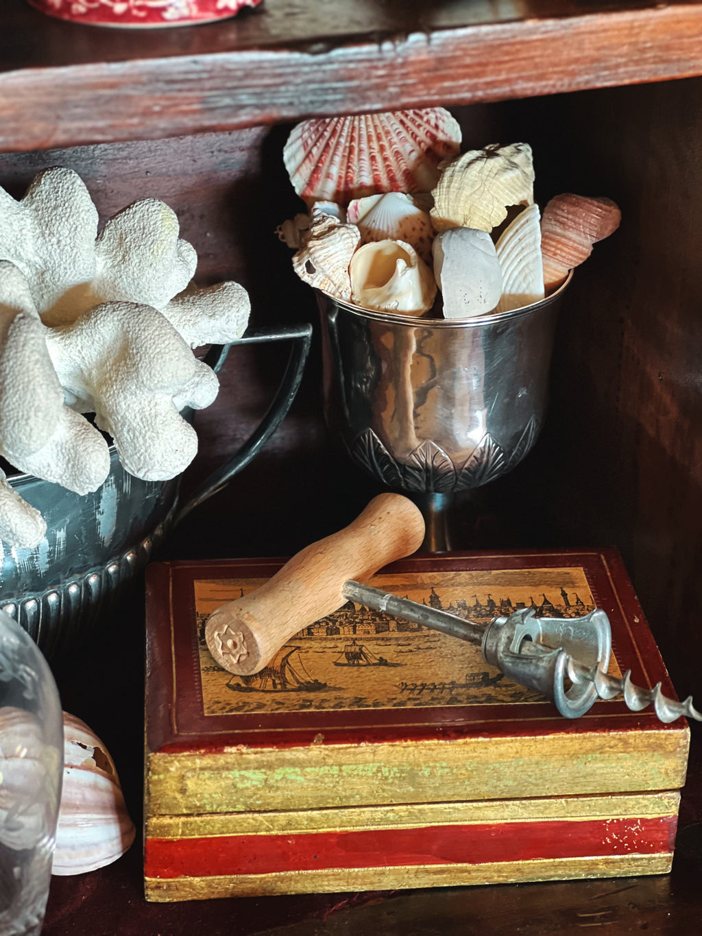 Vintage Florentine trinket box styled on table with books and decor