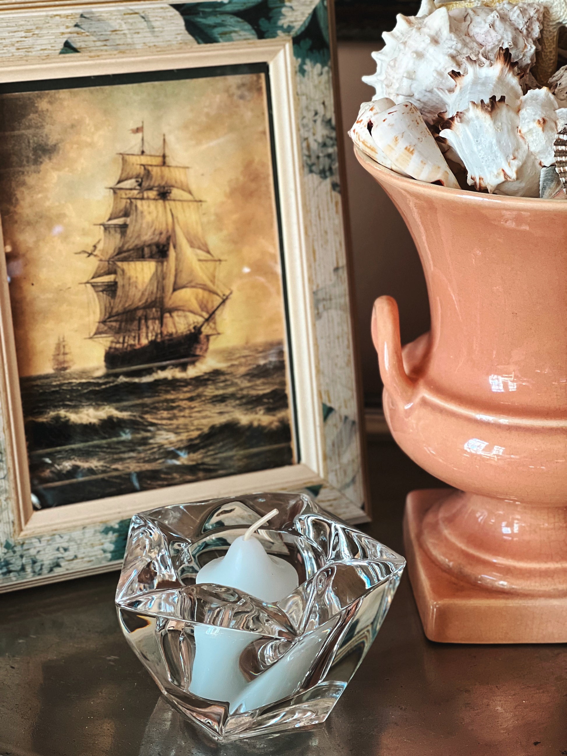 Side view of vintage crystal starfish candle holder showing sculpted glass detail