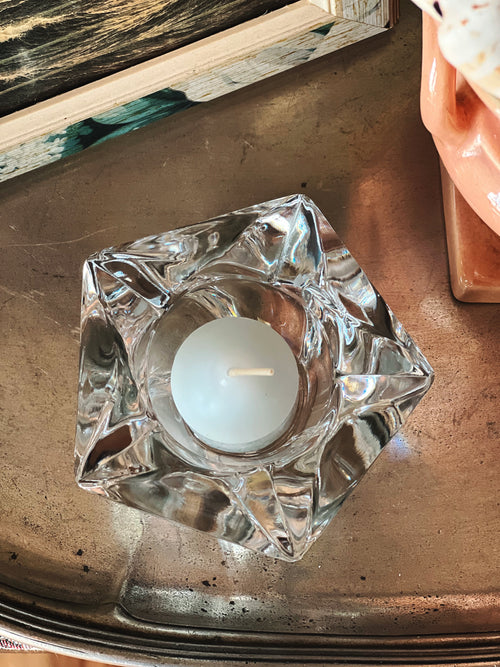 Clear cut glass starfish votive holder with faceted edges and tealight candle