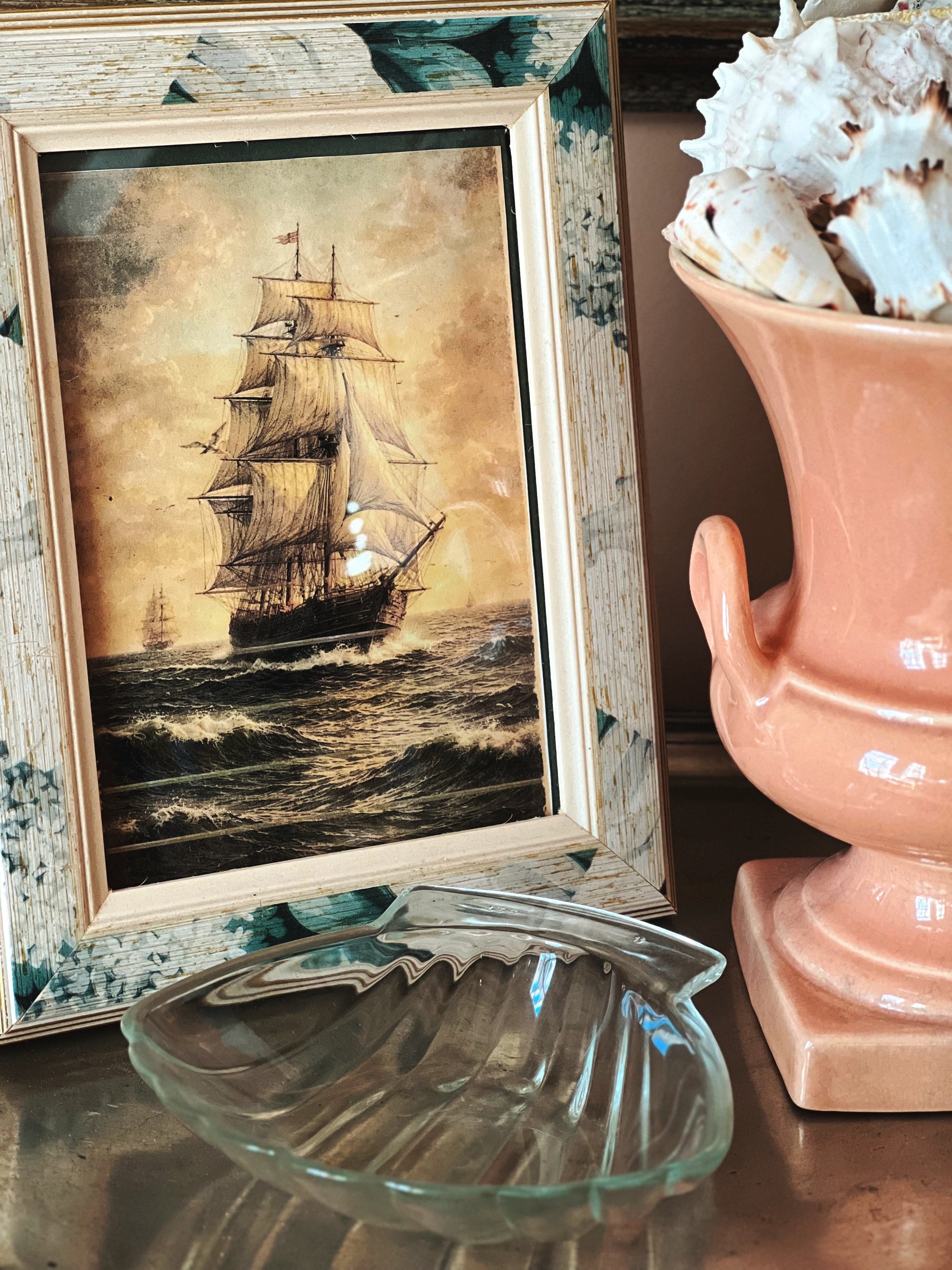 Glass scallop shell dish styled in coastal vignette, French vintage decor