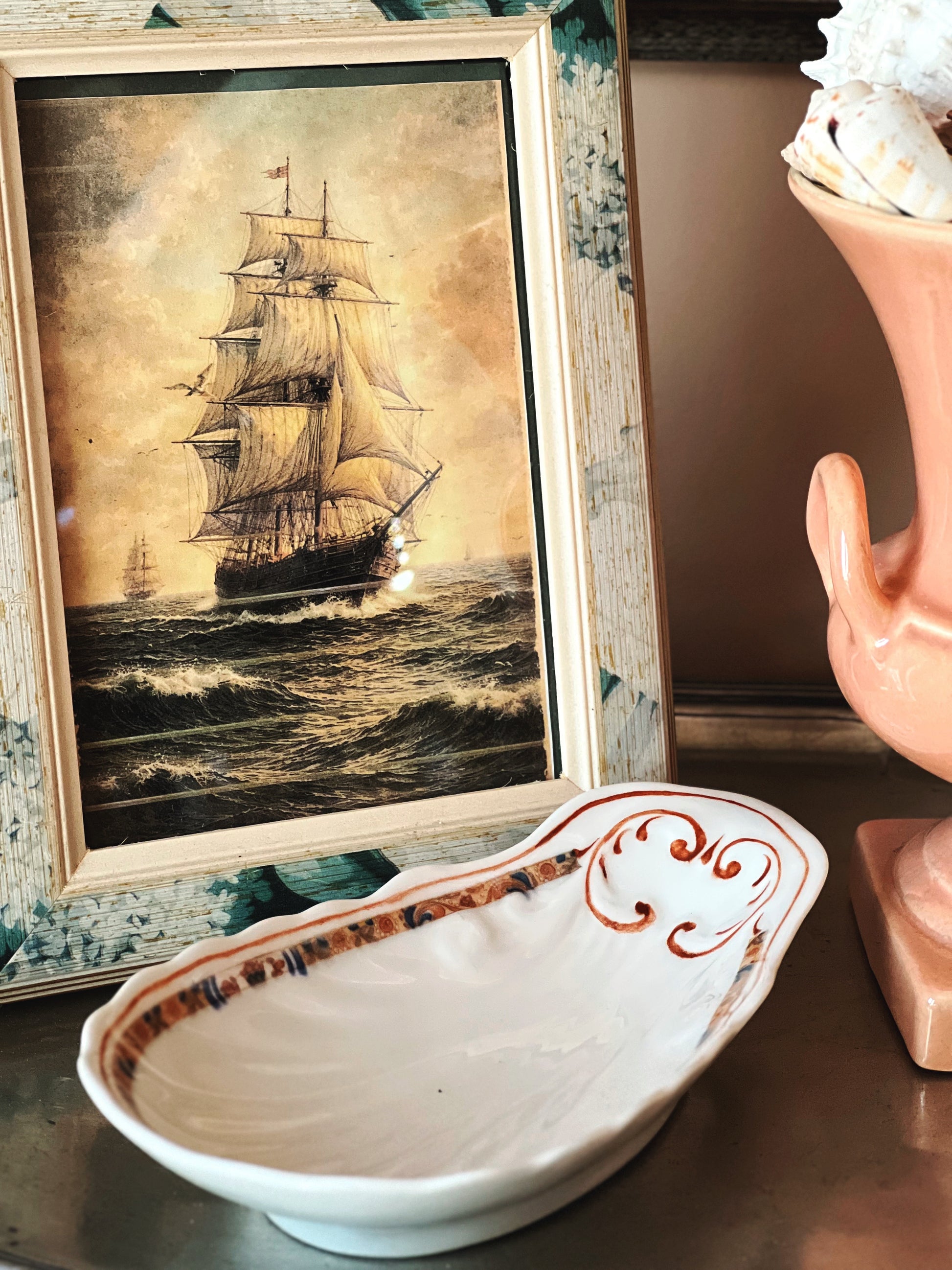 Side view of vintage elongated shell serving dish showing shape and detailing