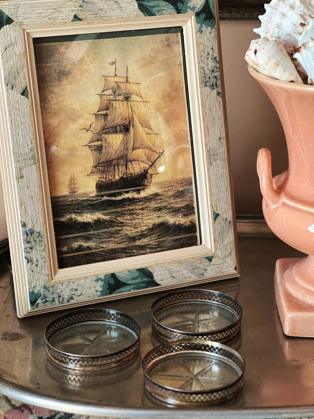 Vintage coasters styled on shelf with decor