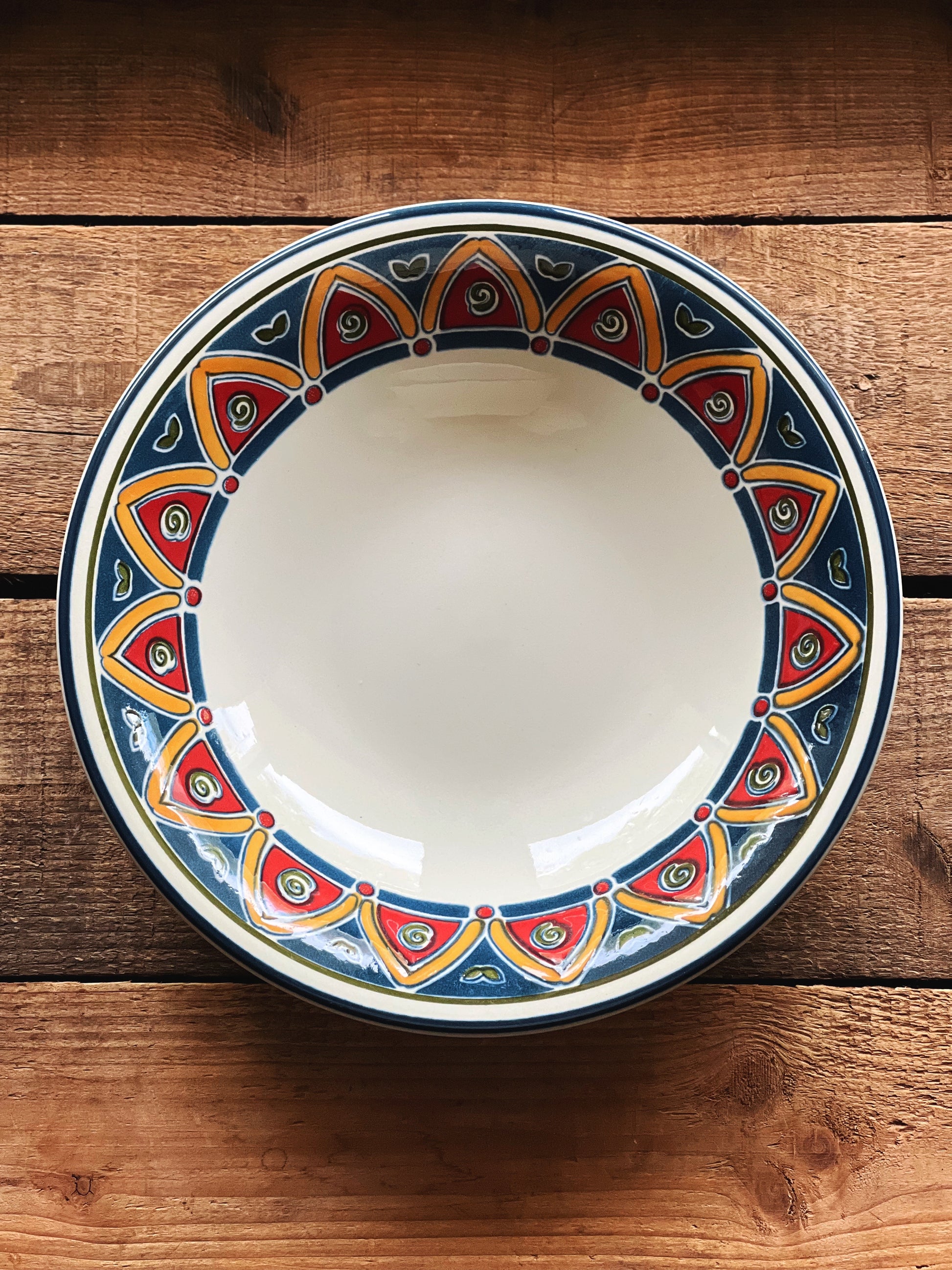 Vintage Pier 1 Marrakesh soup bowl with blue and red mosaic border, styled on wood surface with warm natural tones