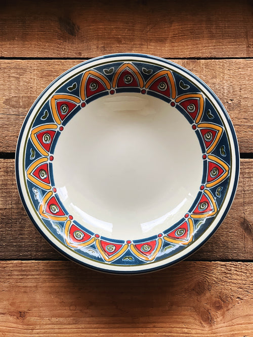 Vintage Pier 1 Marrakesh soup bowl with blue and red mosaic border, styled on wood surface with warm natural tones