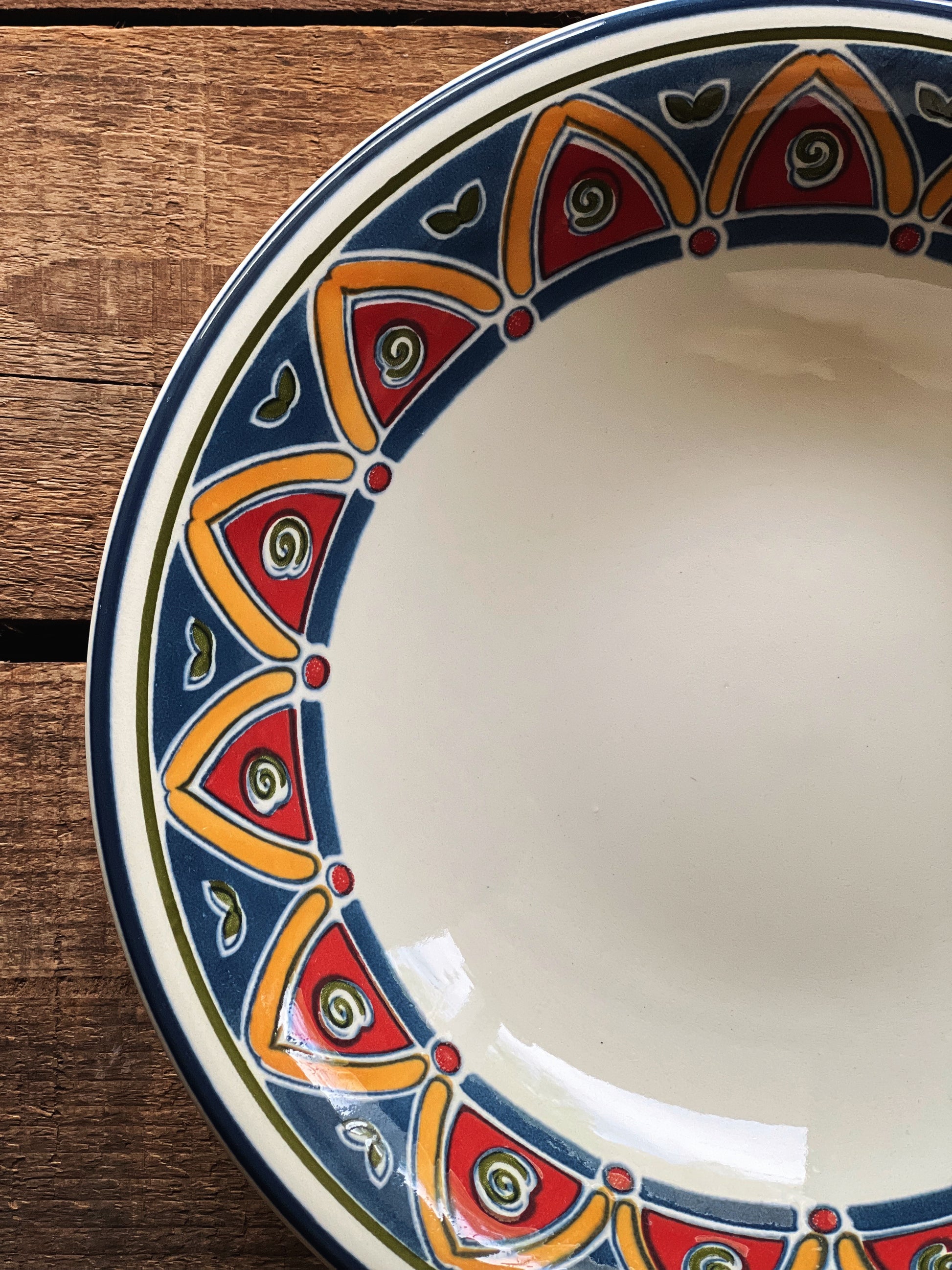 Close view of blue and red mosaic pattern on vintage Pier 1 Marrakesh bowl