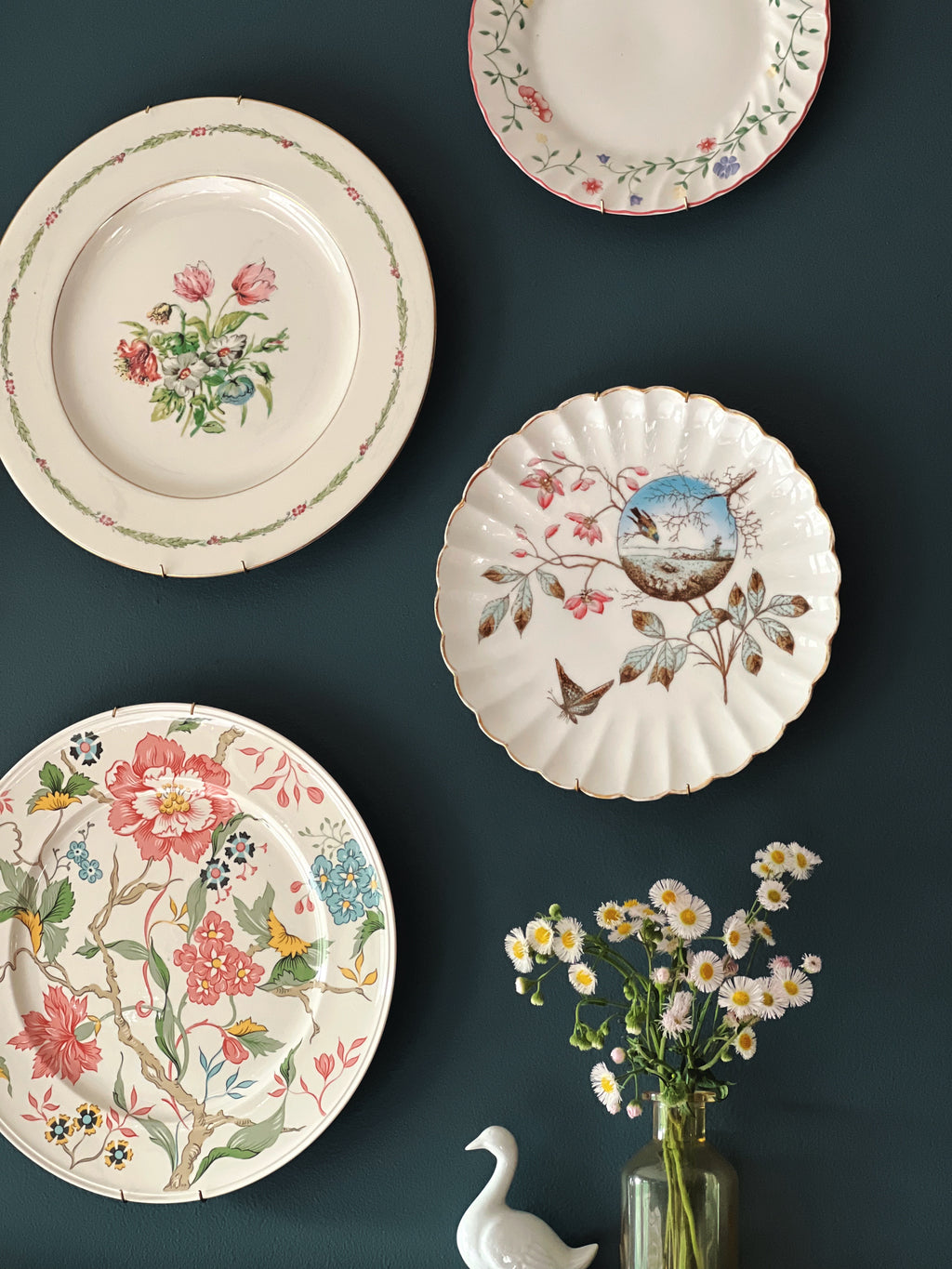 scalloped floral bird plate styled in vintage plate wall arrangement