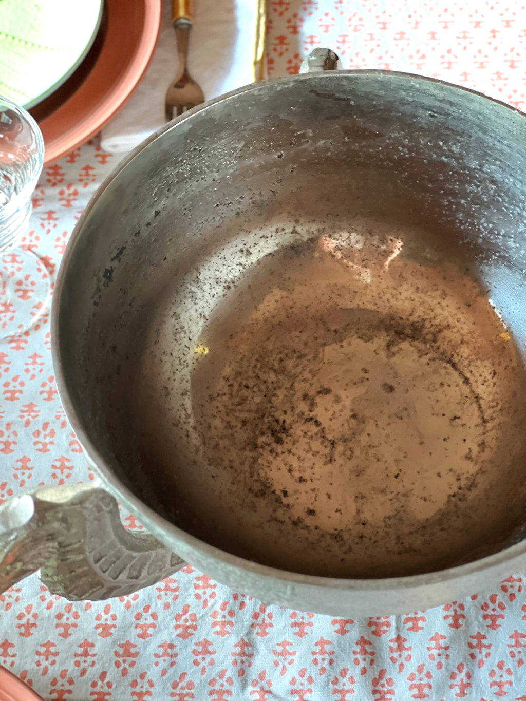 Interior of vintage silver seahorse bowl showing natural wear and patina
