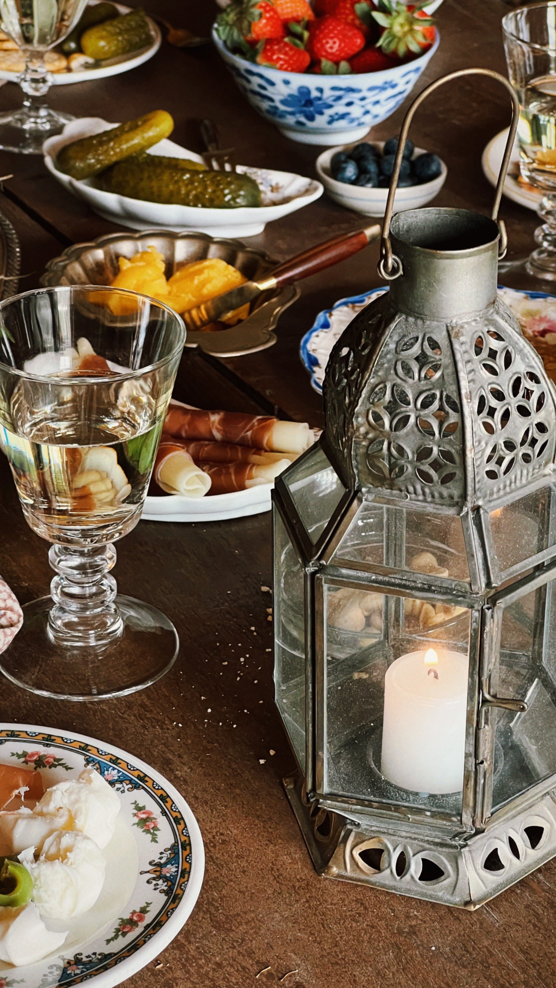 tabletop set with a moroccan style lantern and charcuterie