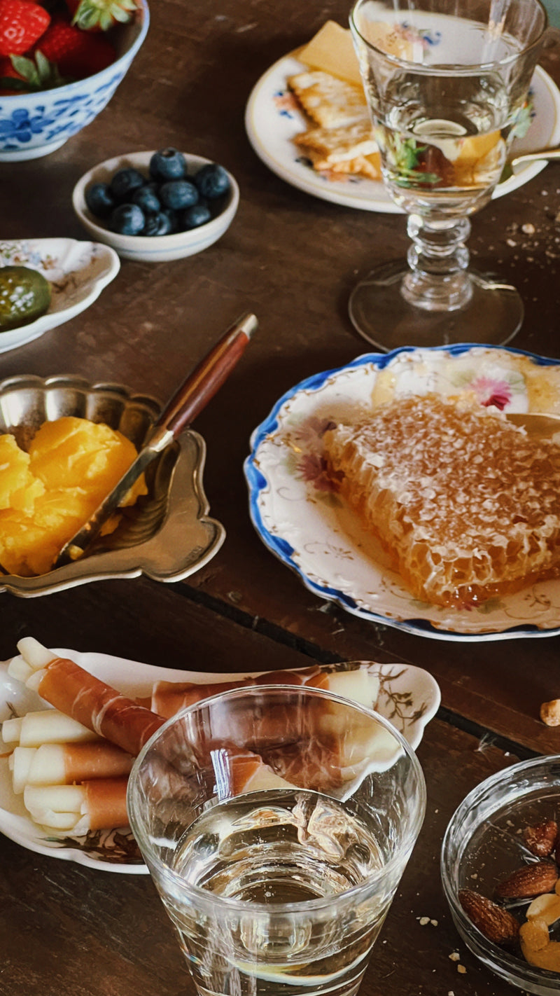 small vintage floral plate with honeycomb on rustic table setting