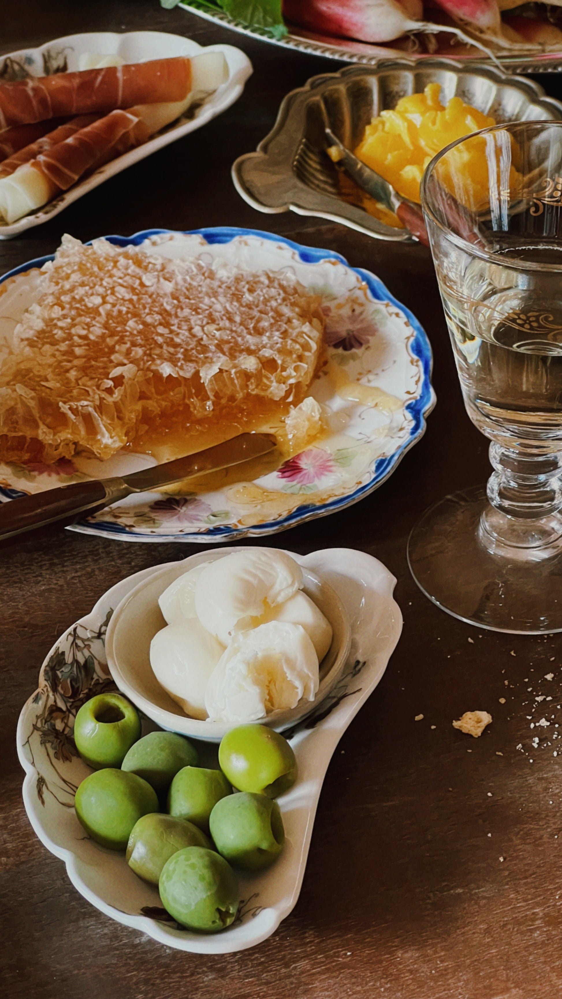 vintage prep bowls with olives and small ingredients on table