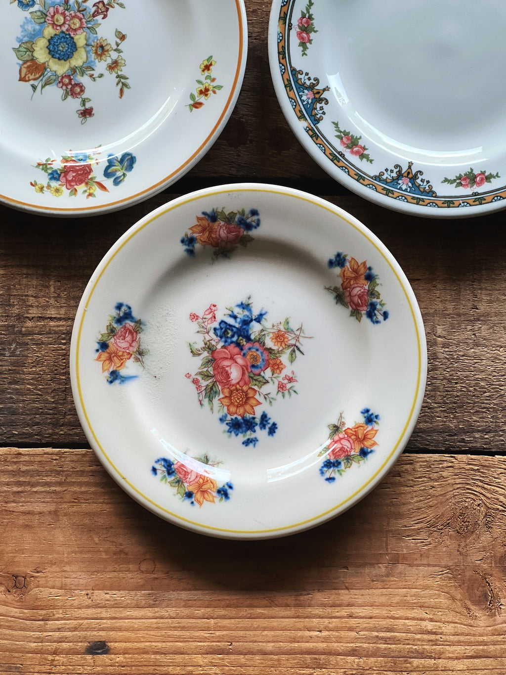 small vintage floral china plate with yellow edge