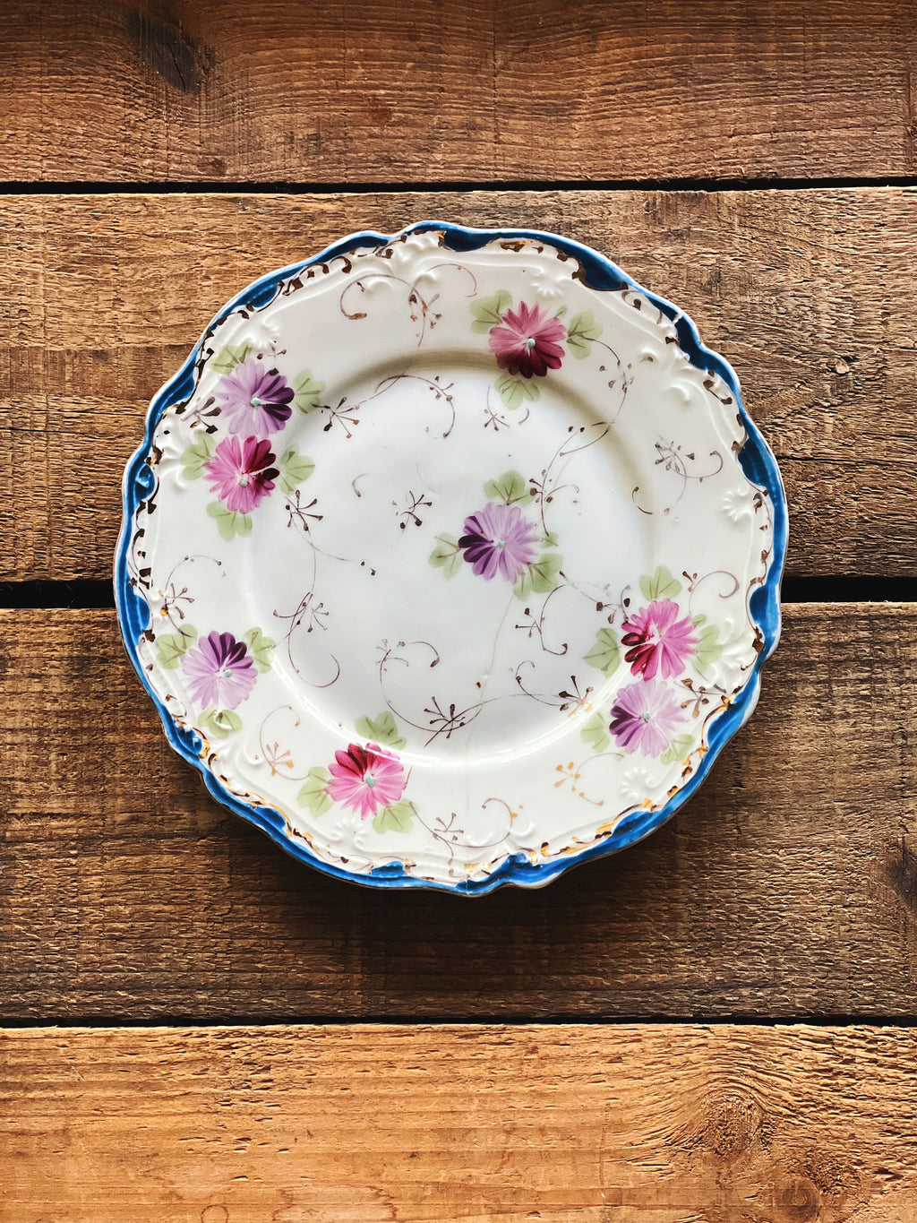 small hand painted floral bone china plate with scalloped edge