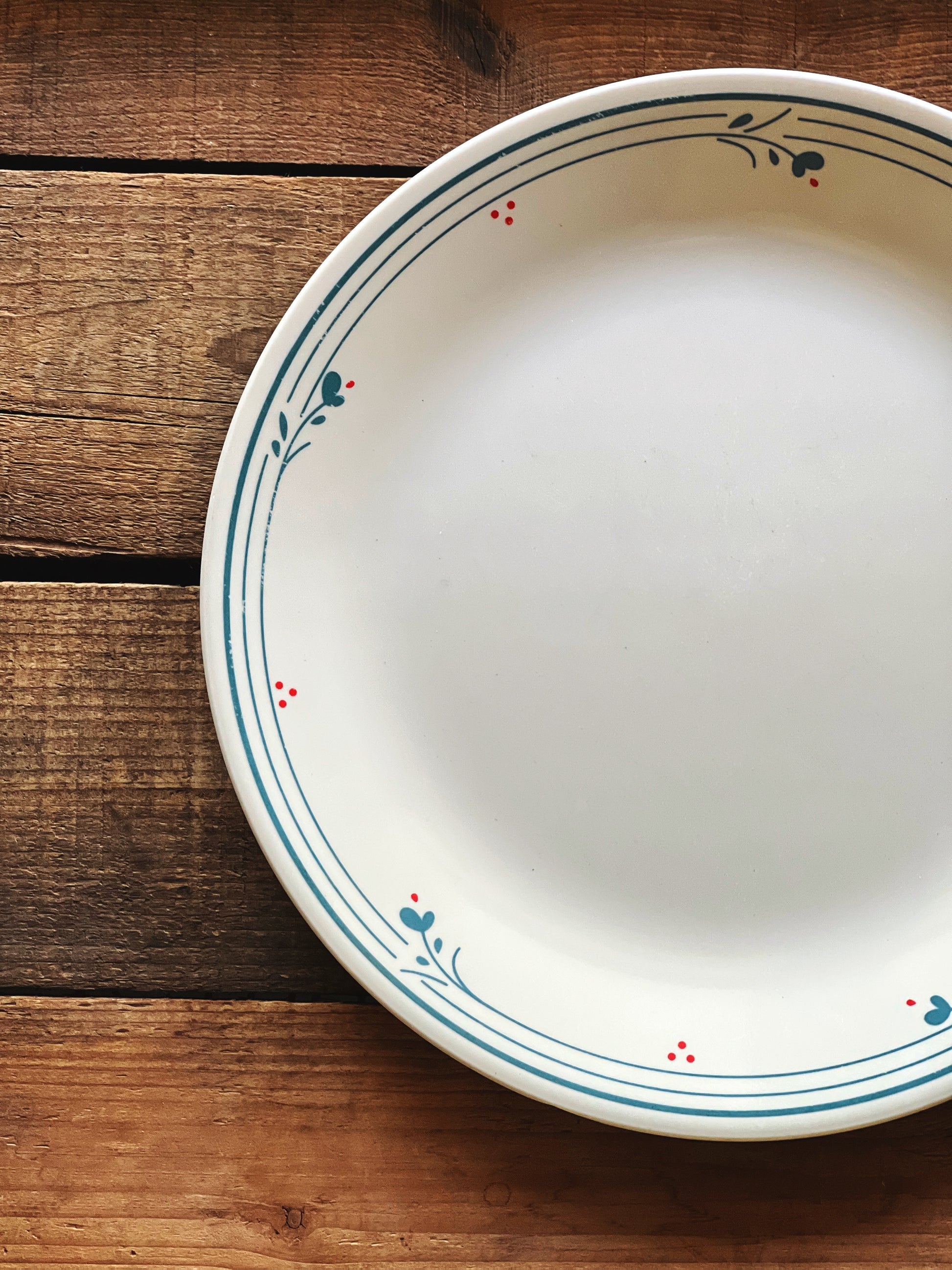Close view of Corelle Country Violets pattern showing delicate blue floral detail