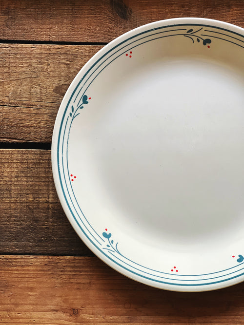 Close view of Corelle Country Violets pattern showing delicate blue floral detail