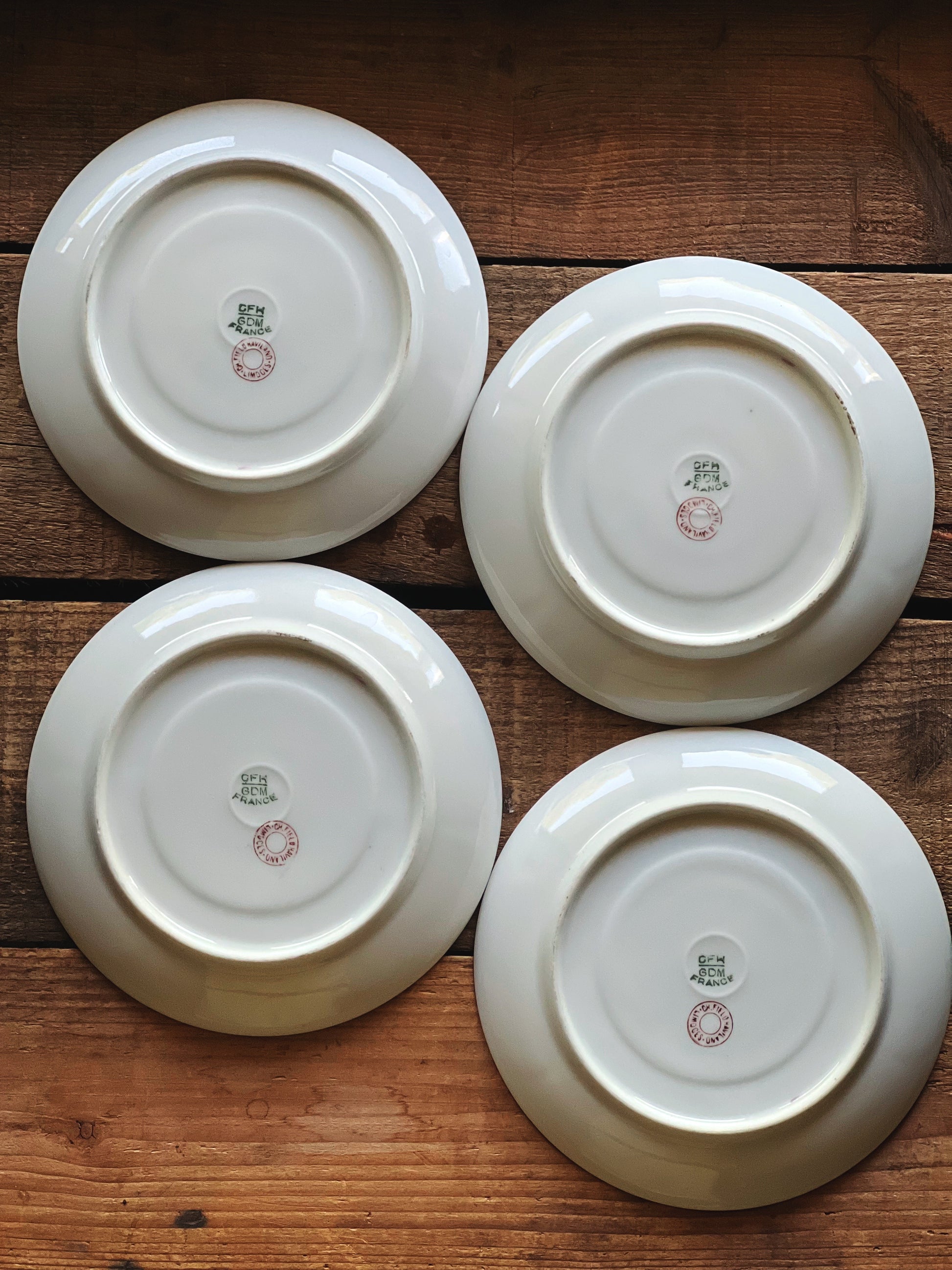 Underside of vintage Limoges saucers showing French maker’s marks