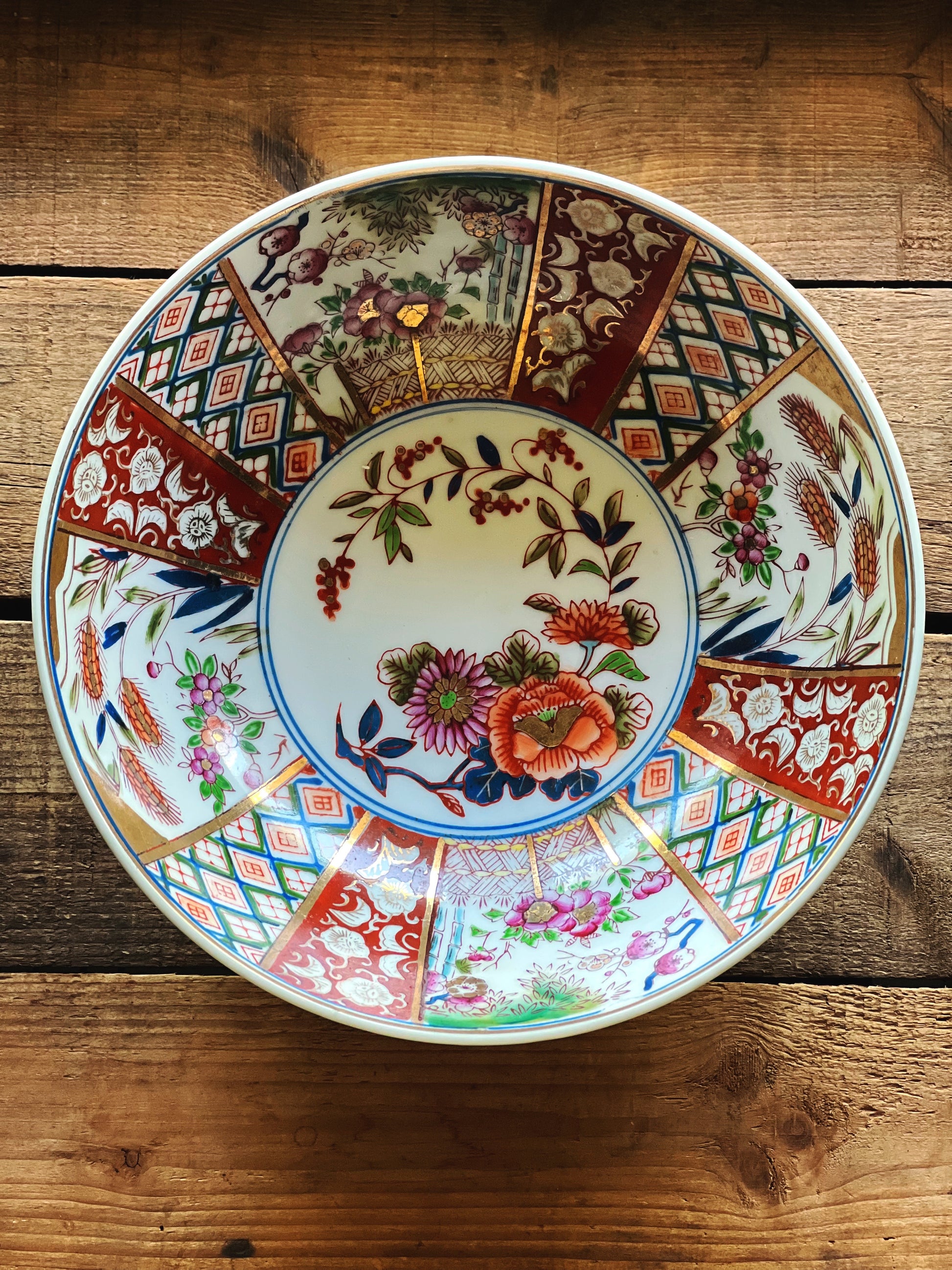 Overhead view of vintage Imari style bowl showing intricate hand painted pattern and detailed interior design