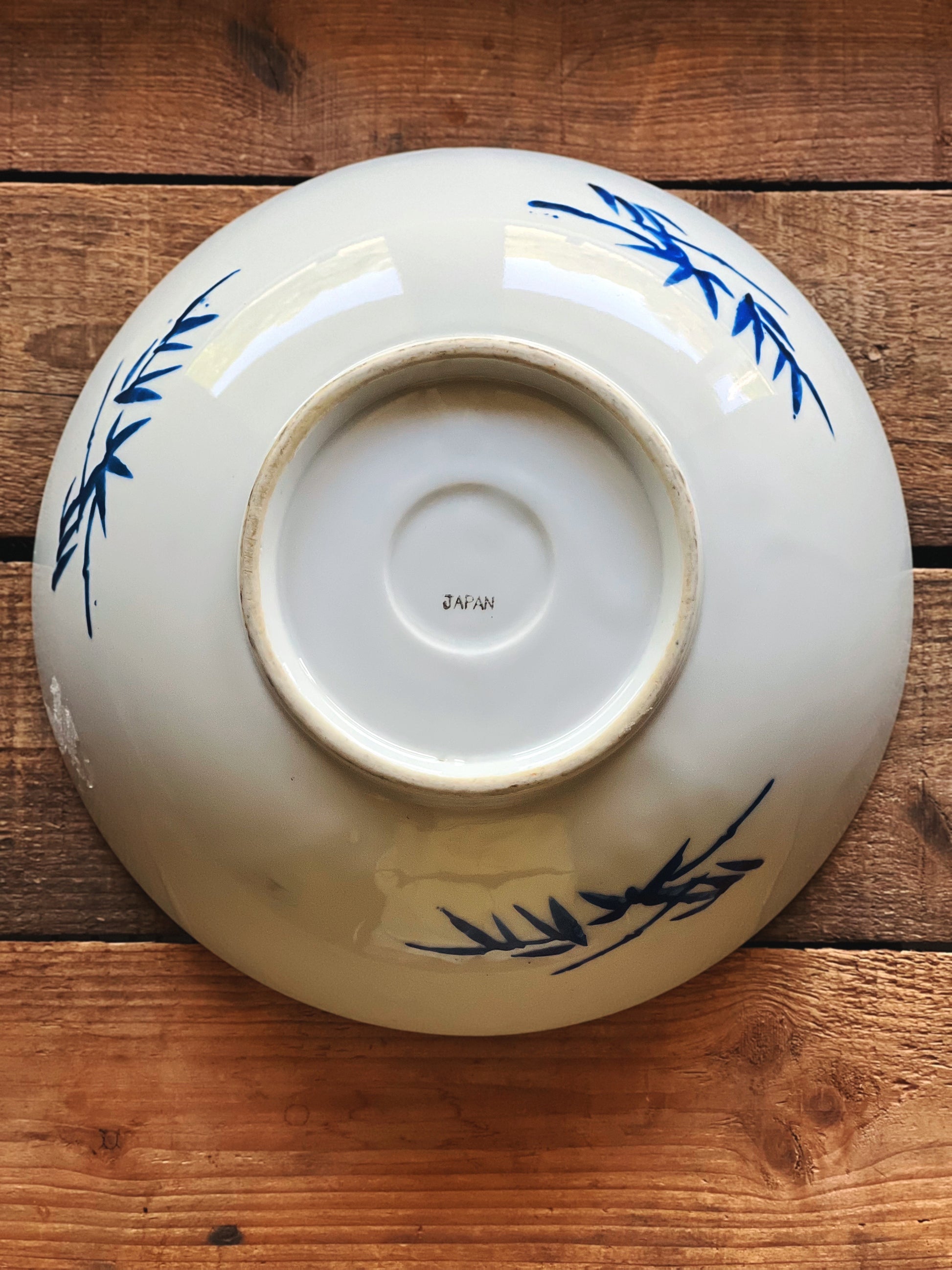 Underside of vintage Japanese bowl showing base and maker markings