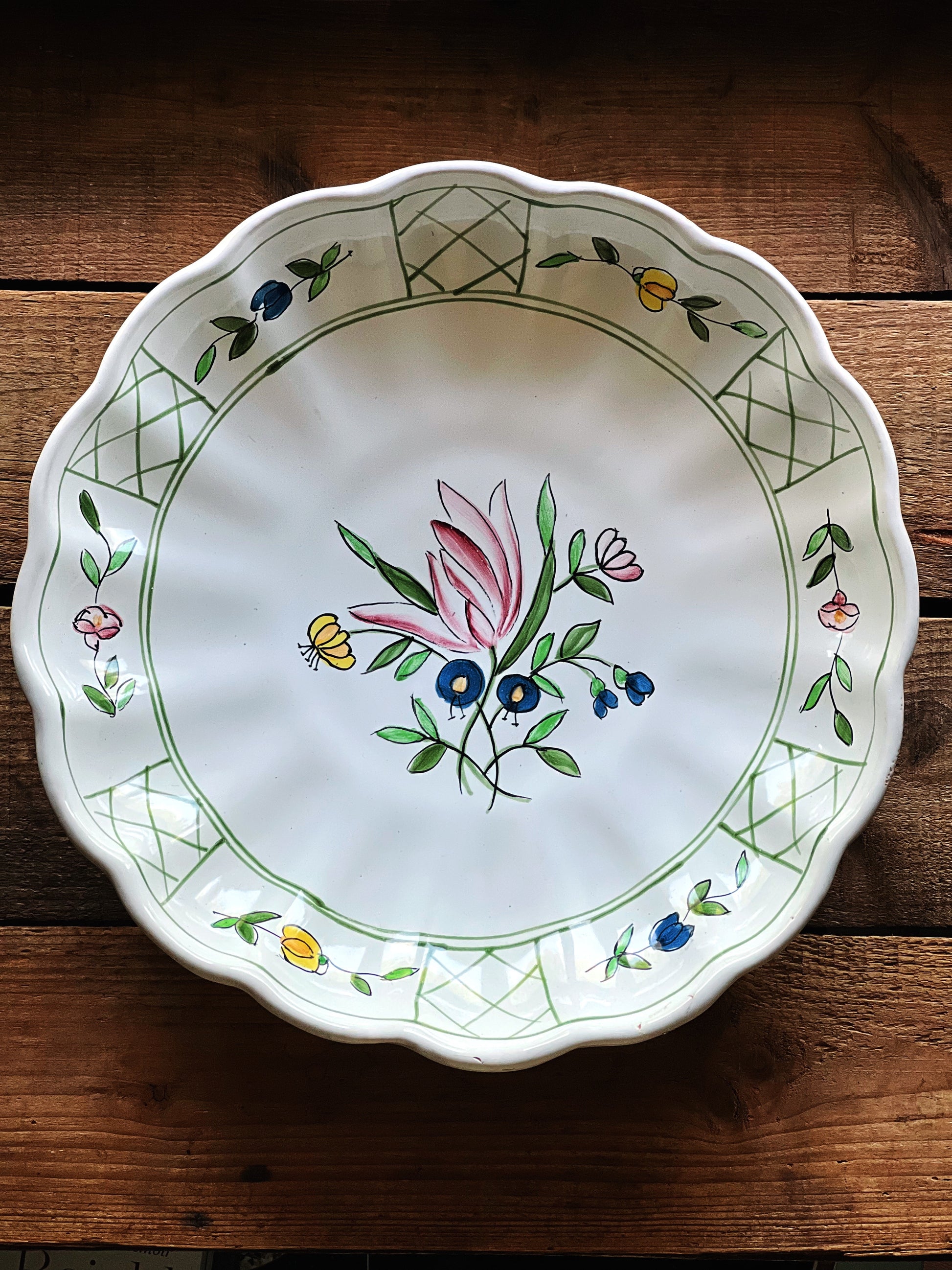 Hand painted Corzine Italy serving bowl with scalloped edge and soft floral design on white ceramic