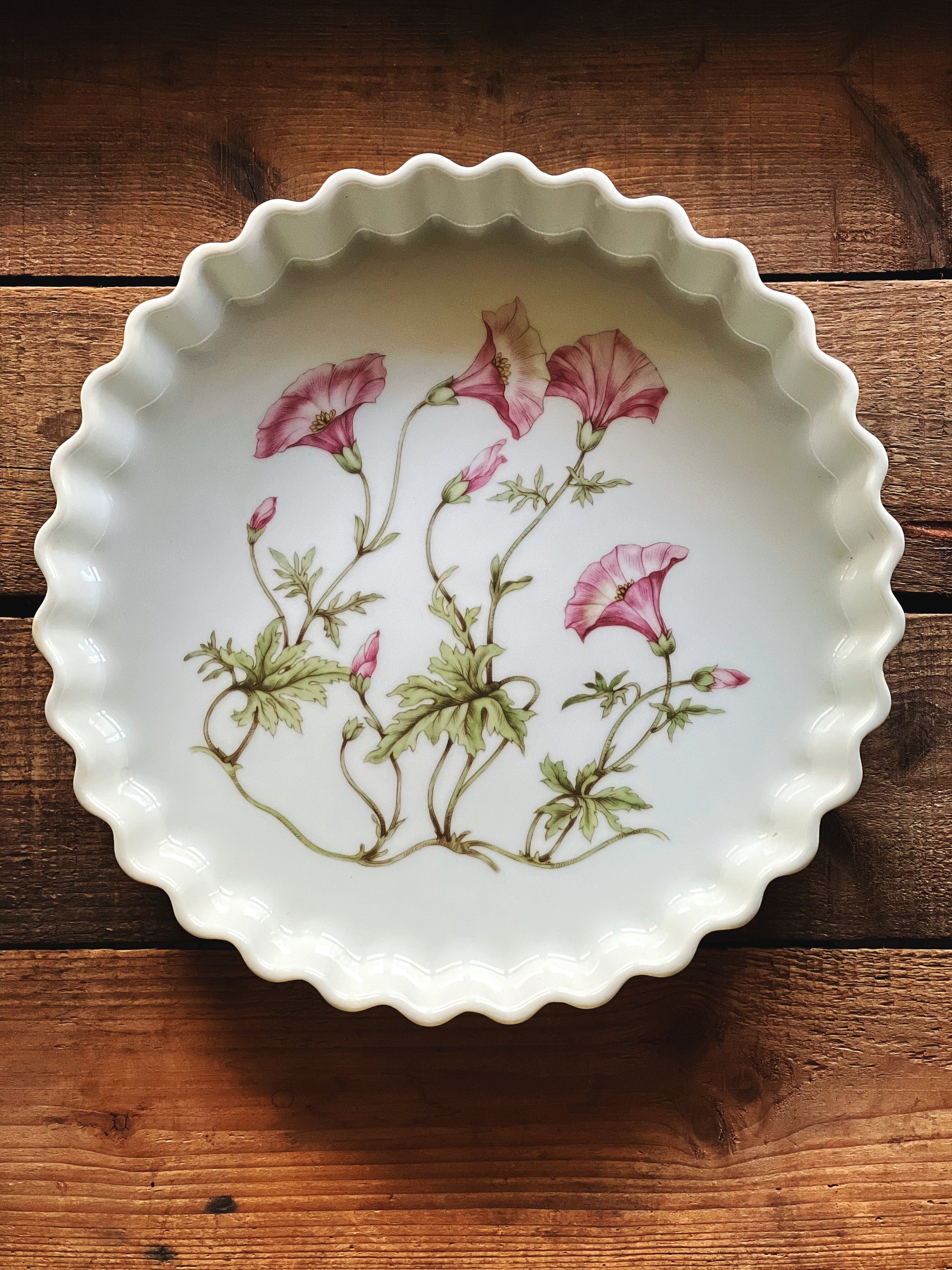Overhead view of Pillivuyt tart pan showing floral interior and fluted edge detail