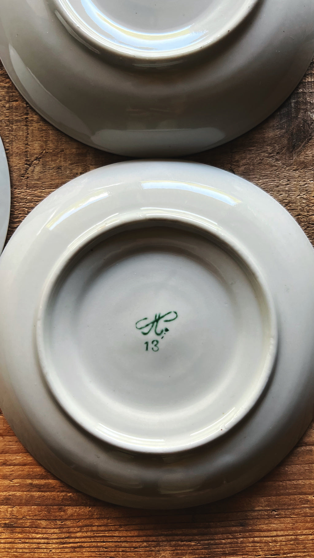 Bottom view of saucers showing base and maker marks