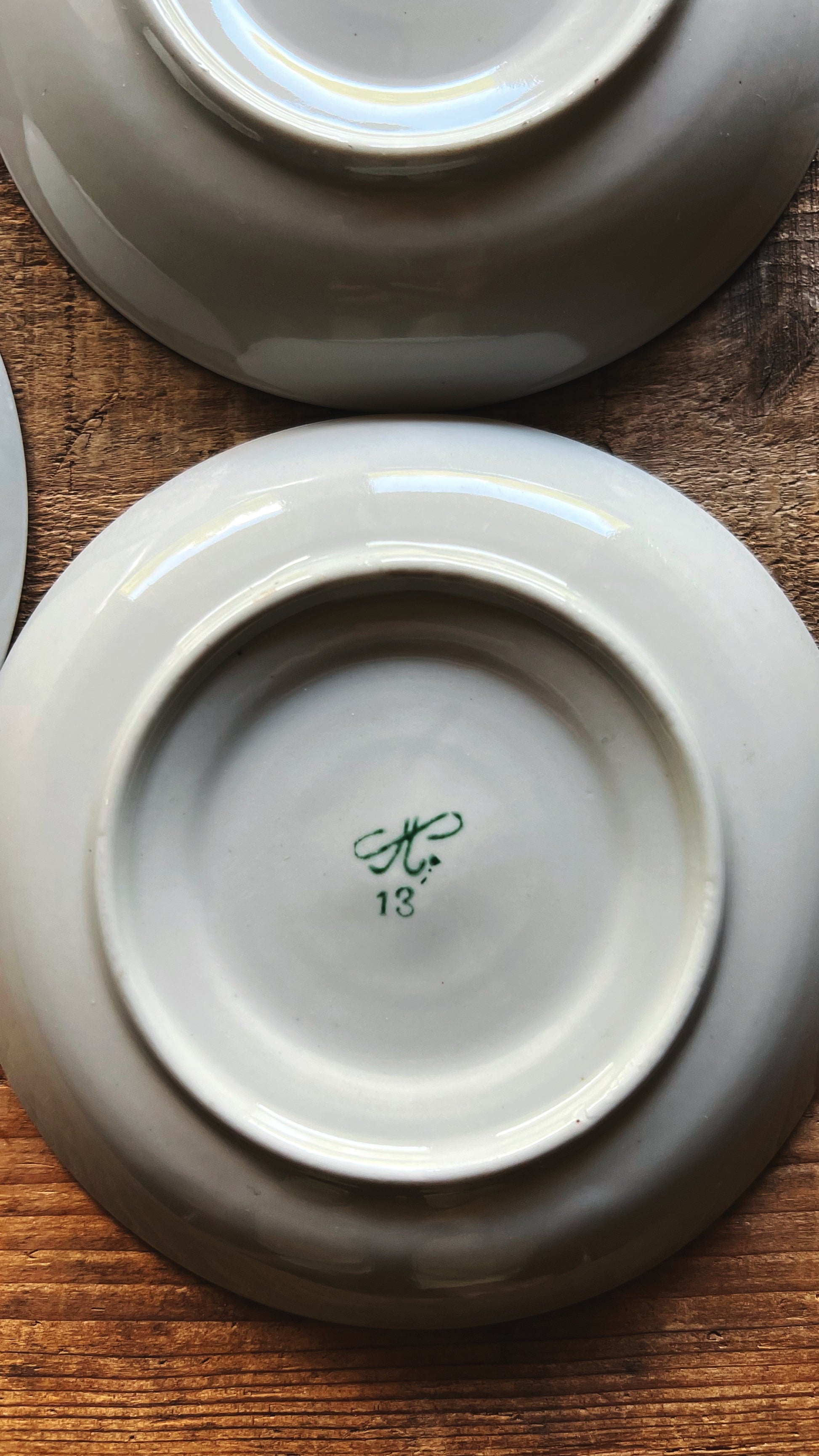 Bottom view of saucers showing base and maker marks