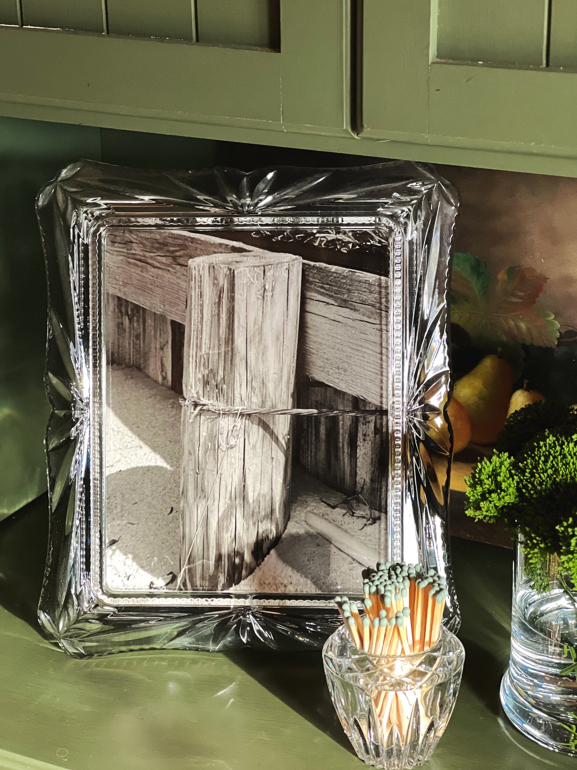 vintage glass photo frame styled on shelf with decorative objects