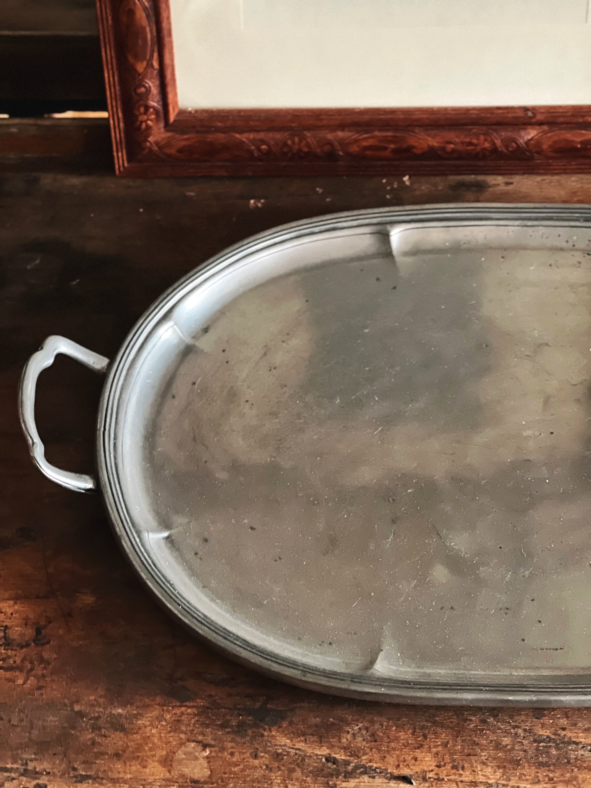 overhead detail and patina of vintage pewter tray